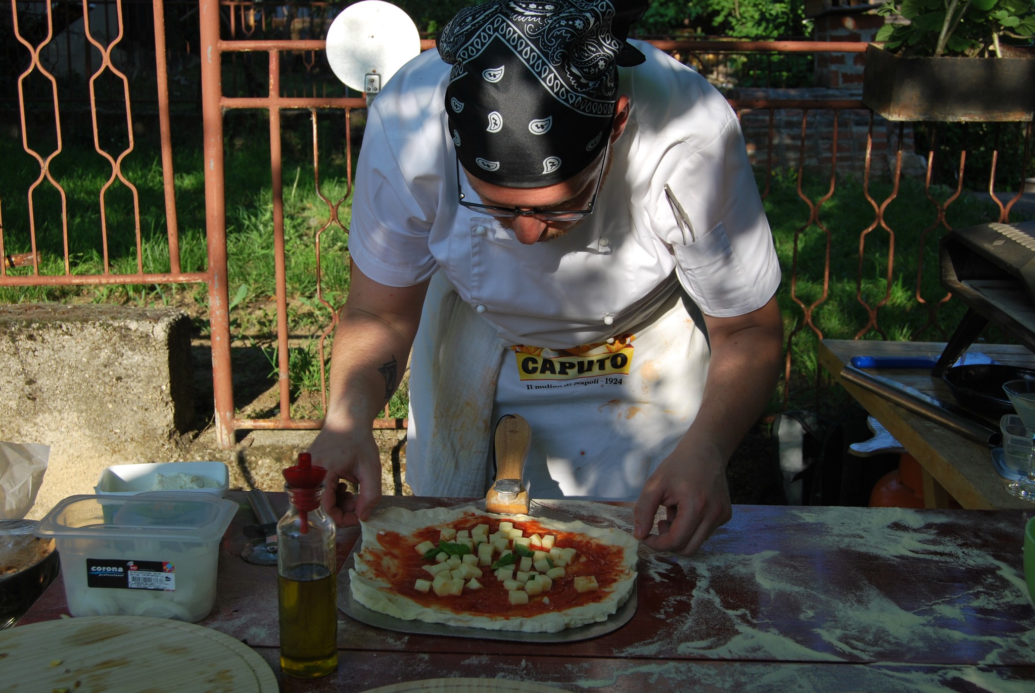 Close up of a Pizza Chef stretching a pizza