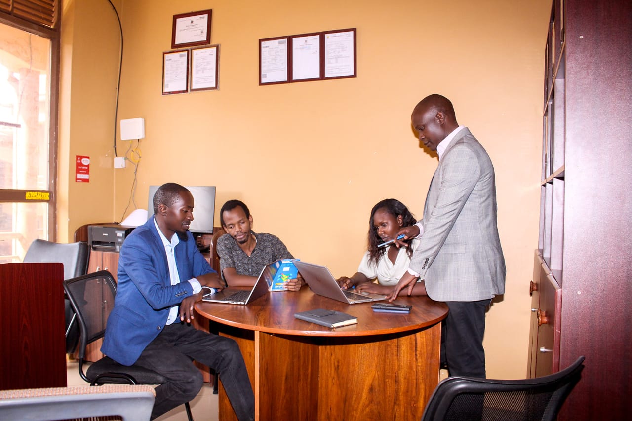 Moodplex Ventures Group management team collaborating in Kampala, Uganda office