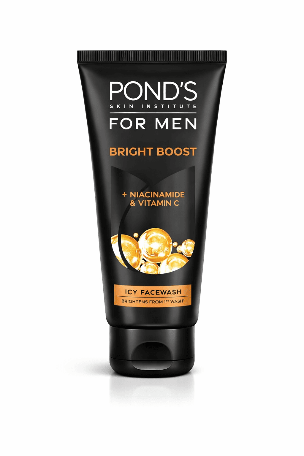 A smiling woman with her arms crossed, standing against a dark green background. She has long, dark hair.