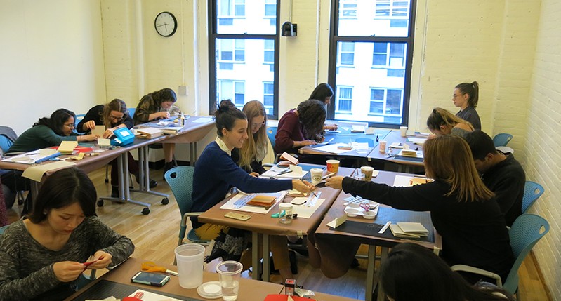 students working with materials and tools in the course class