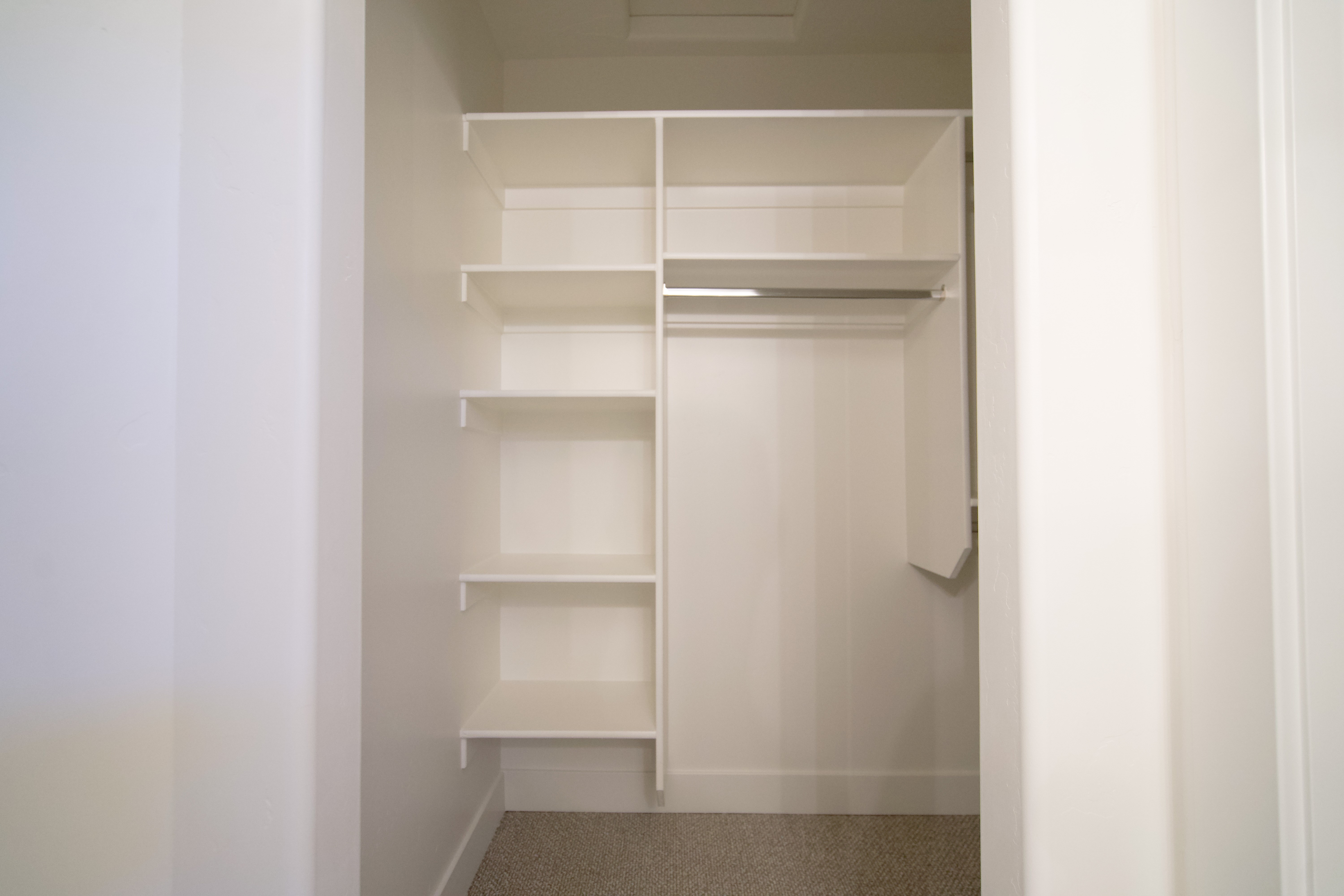 Closet in a Hurricane, Utah remodel with built-in storage and clean modern finishes.