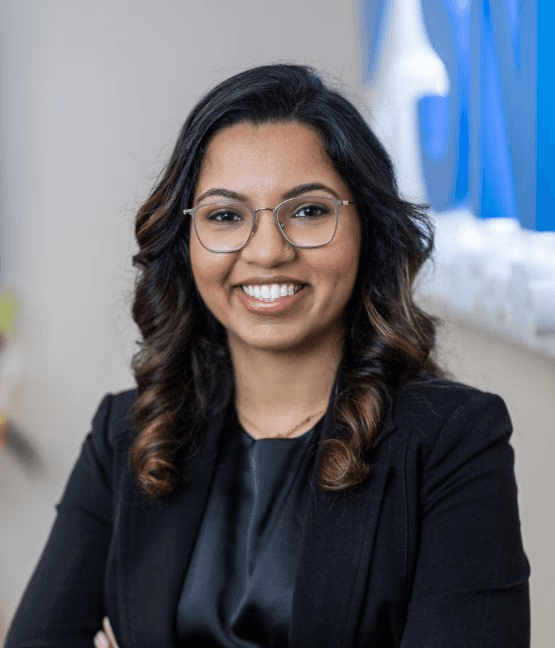 Dr. Simrann Rai Sethi smiling in the Milltown dental office