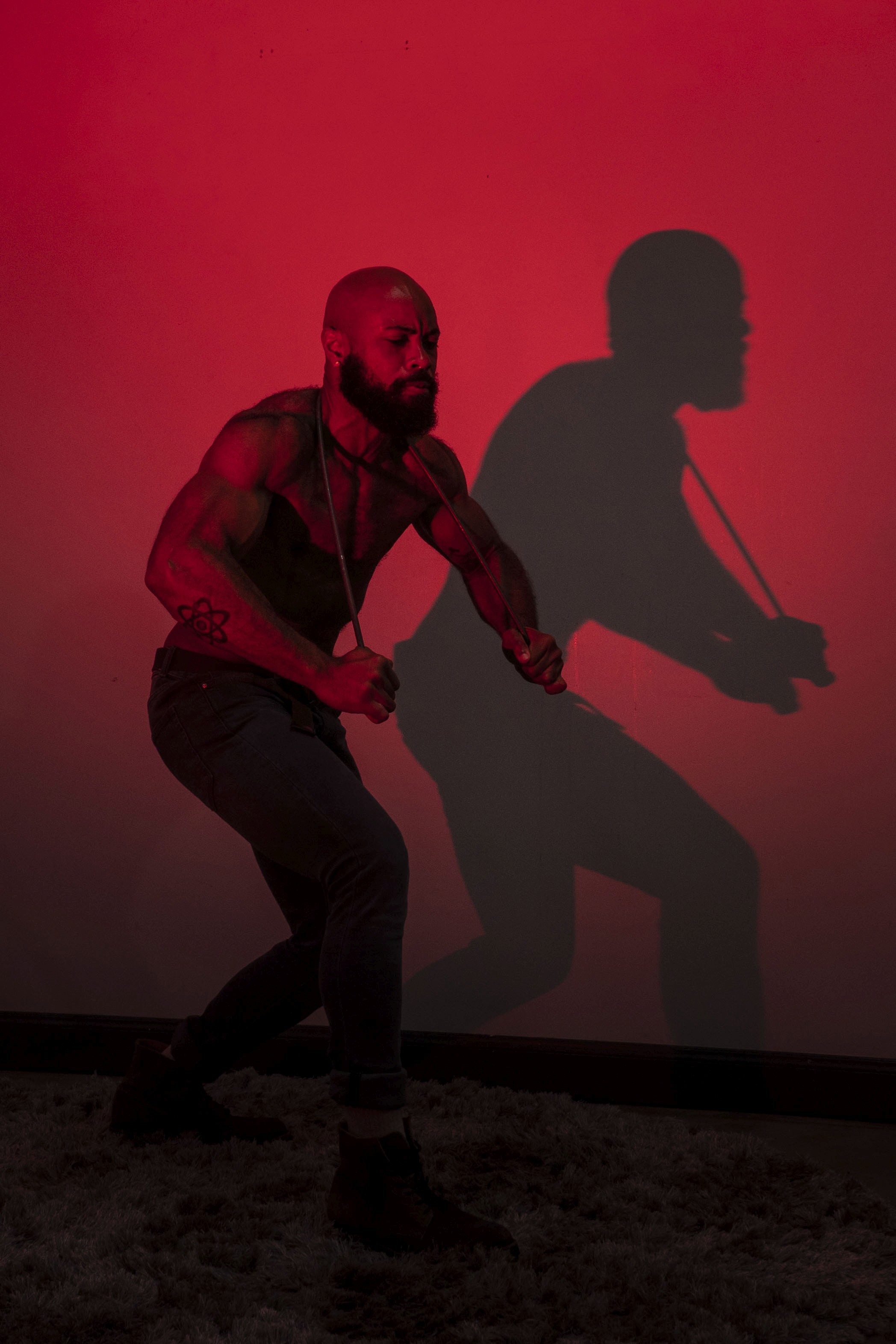 A couple dances closely, showcasing a flowing green dress, against a soft, blurred background of other guests.