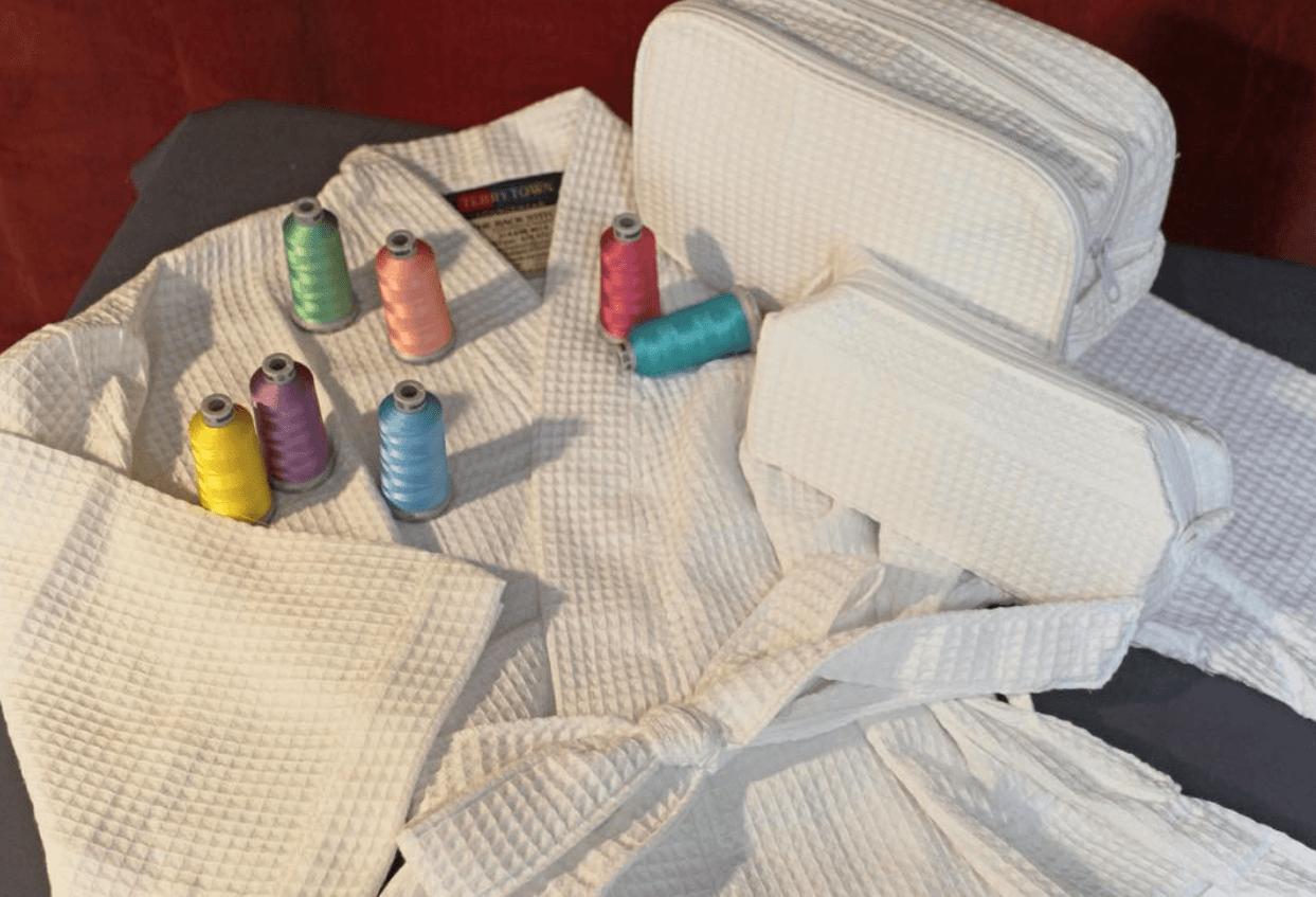 Professional embroidery machine creating custom embroidered apparel and products