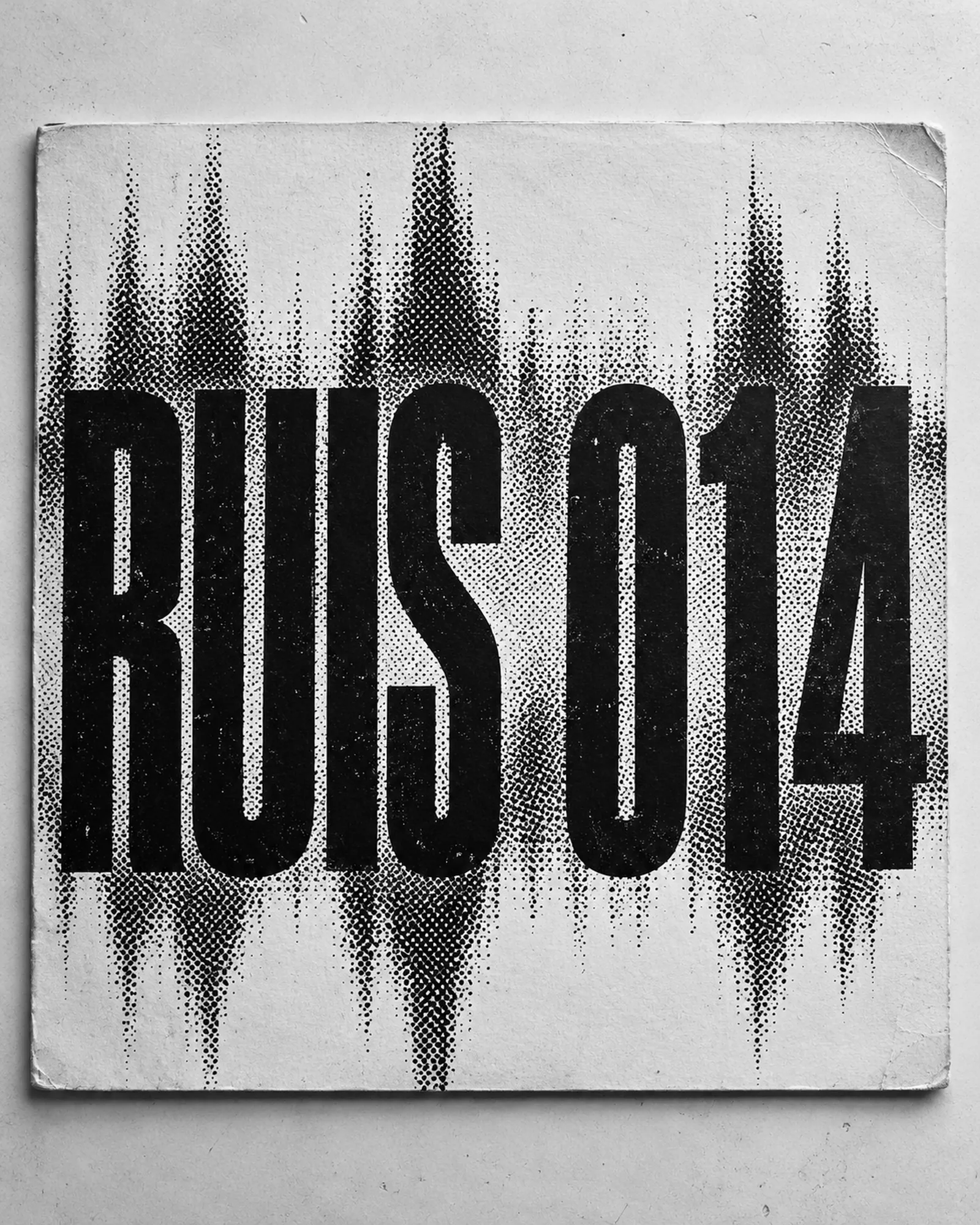 Record sleeve flat on a surface: a coarse black halftone waveform on white card with RUIS 014 set huge across it.