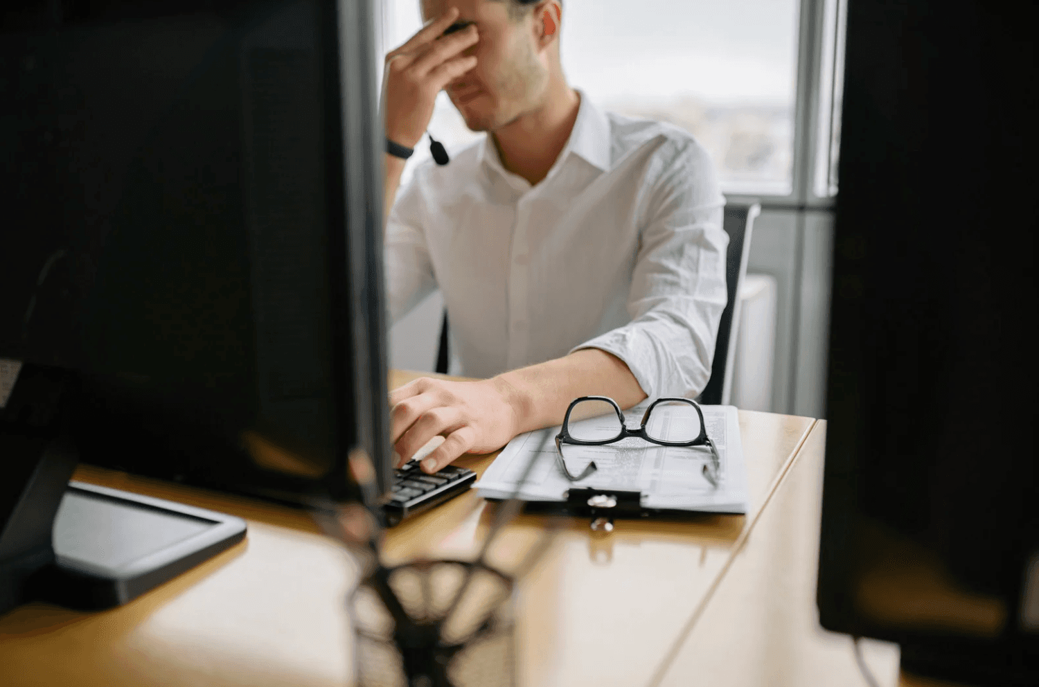 Amazon seller reviewing campaign performance charts and analytics while looking frustrated, highlighting the limits of customer support for strategic advertising decisions.