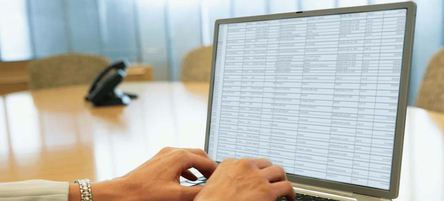 Person typing data into spreadsheet - Google Sheets for Accounting
