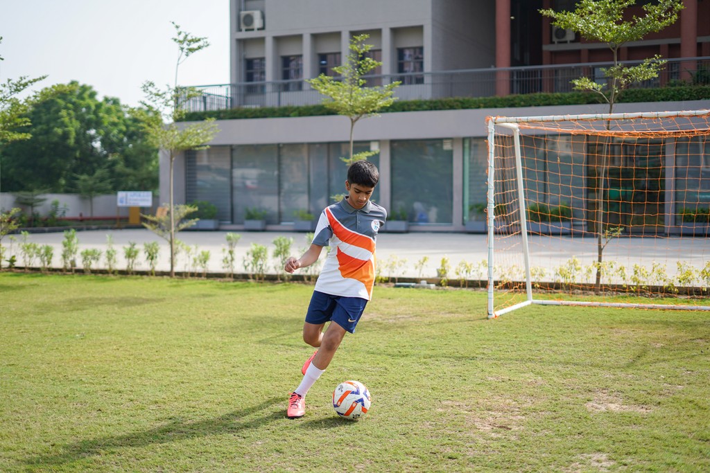 A man stading with Surfboard