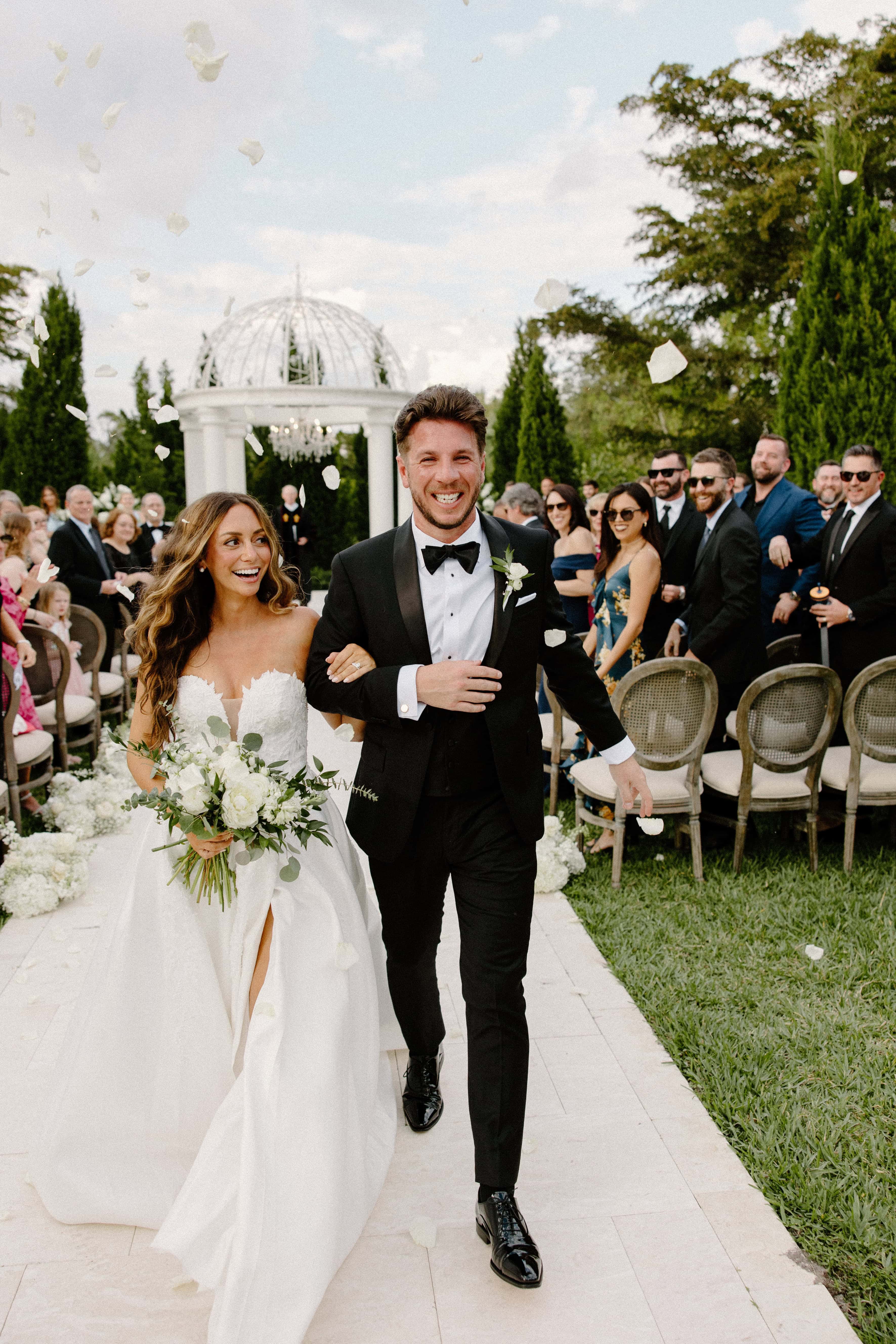 photograph of a couple walking down the aisle