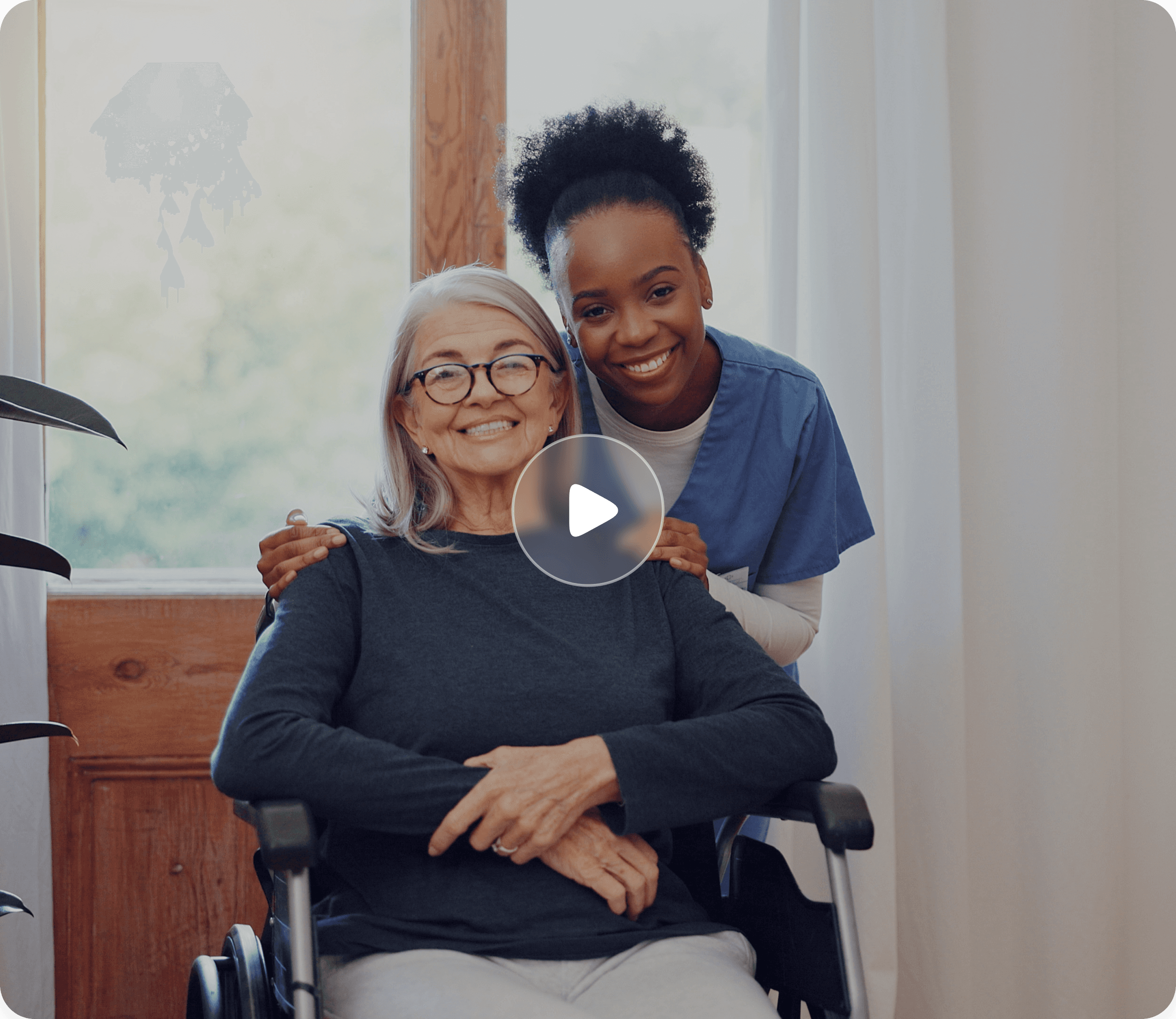 Caregiver supporting an elderly during an in-home care visit.