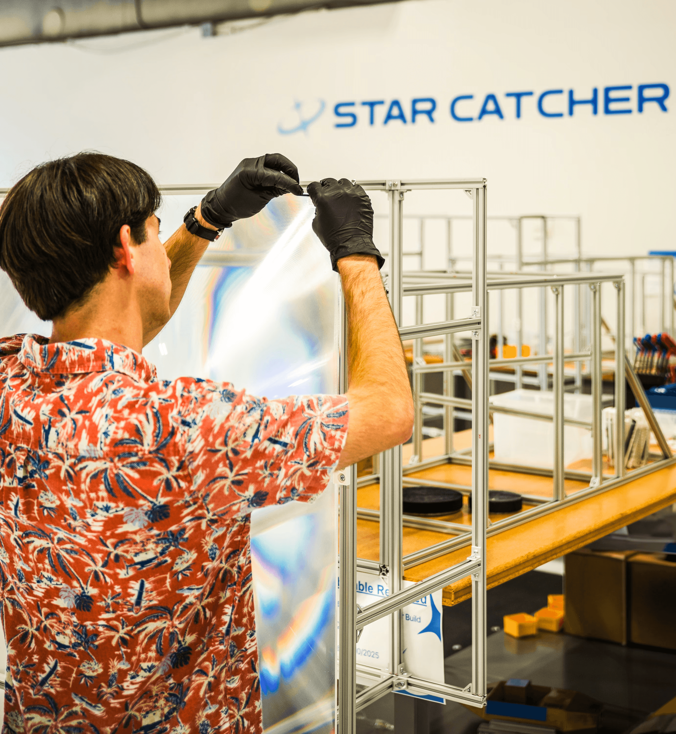 Star Catcher engineer working on solar panels