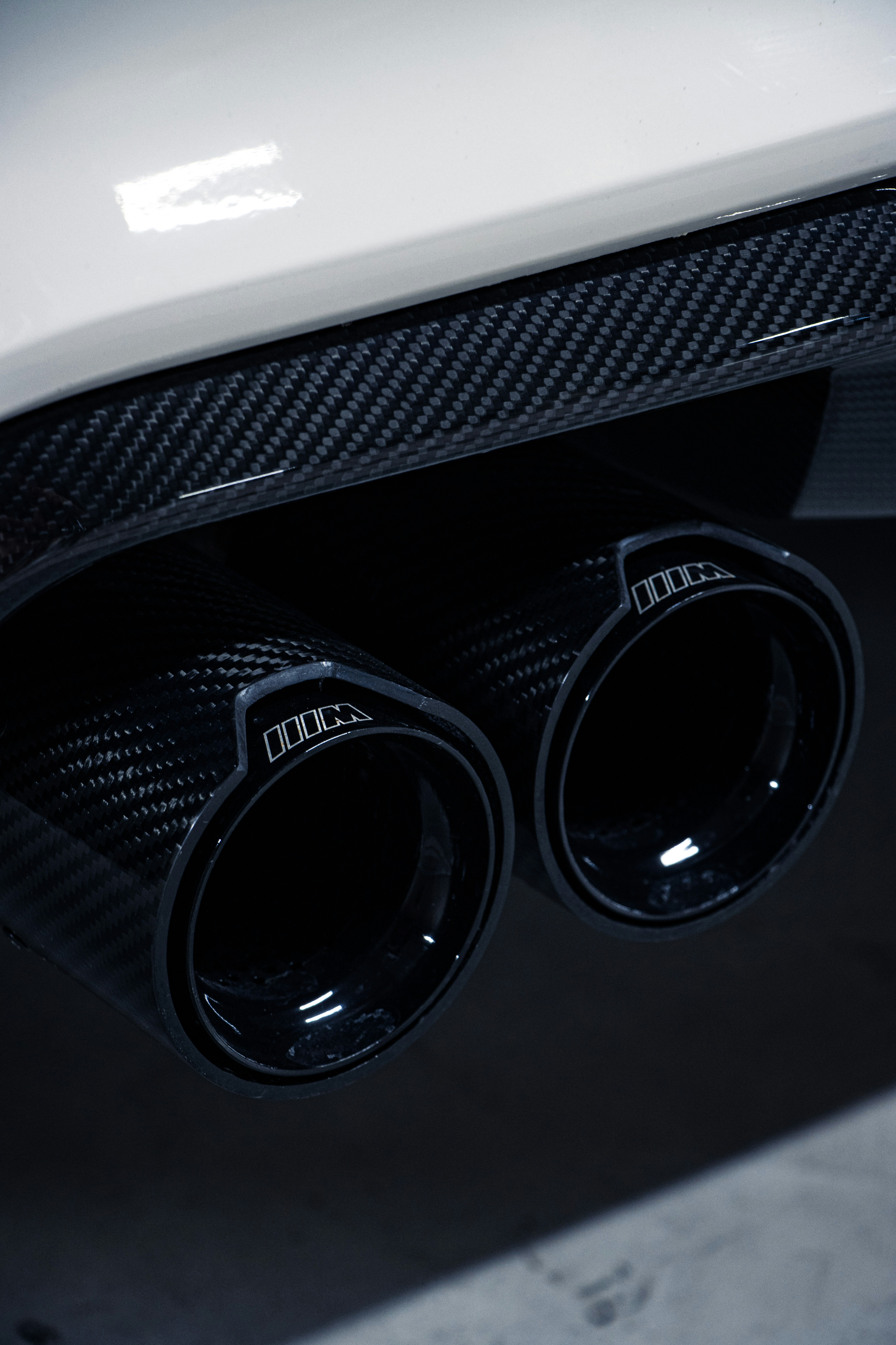 a close up of a car's exhaust pipe