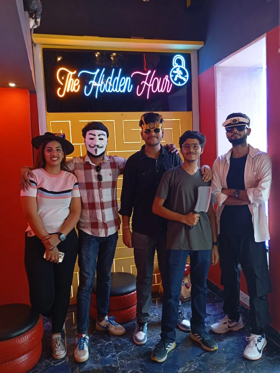 Family and office group having fun with escape puzzles at a birthday event