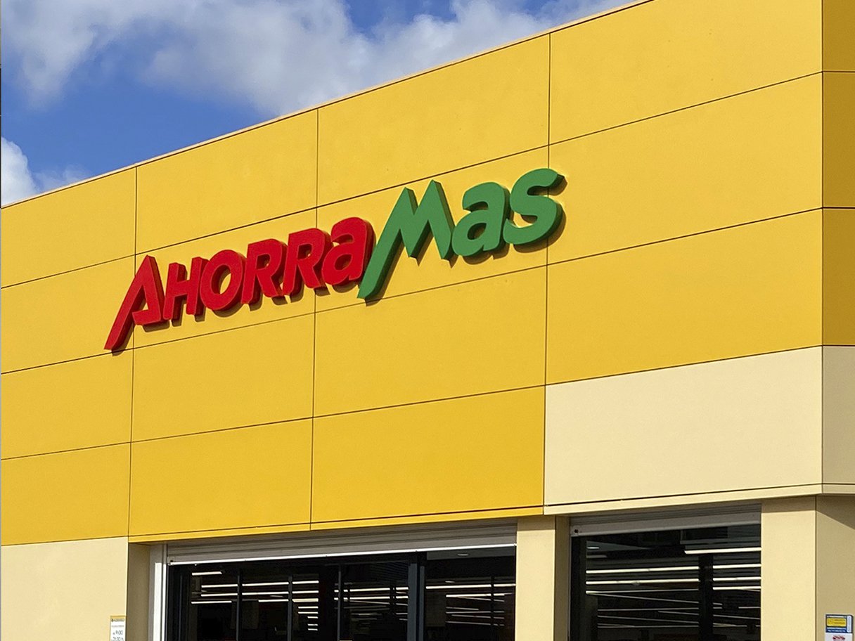 Rustic cabin in a golden field at sunset