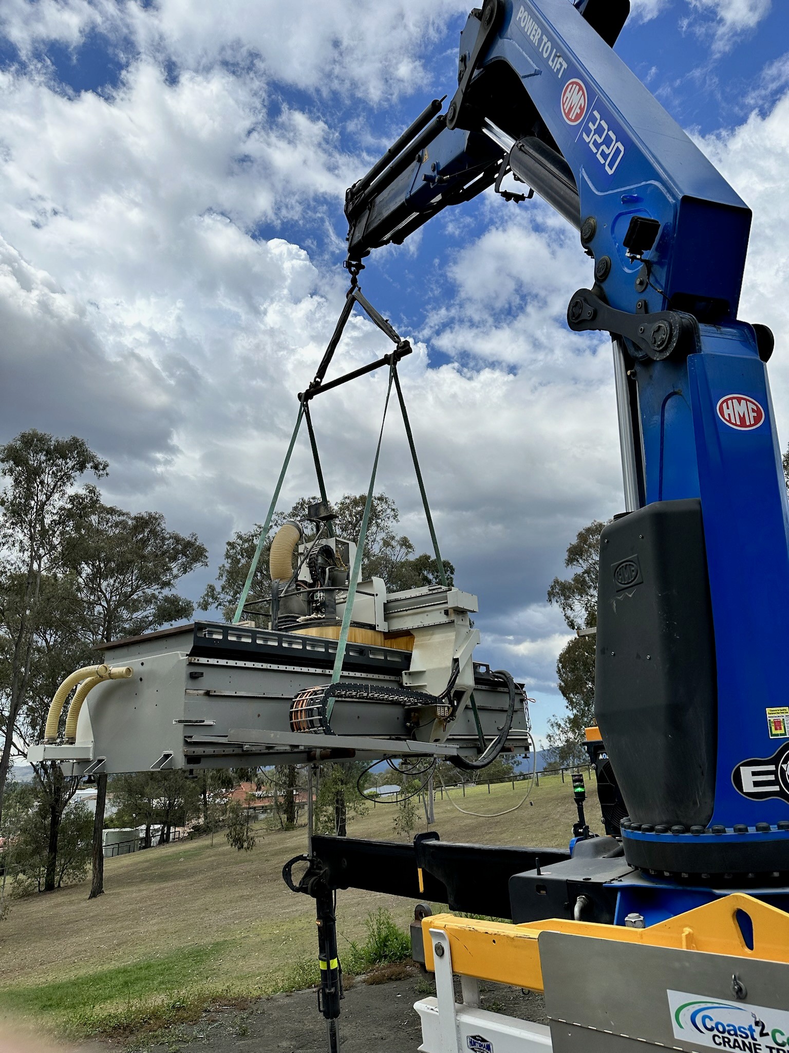 Crane truck lifting heavy equipment