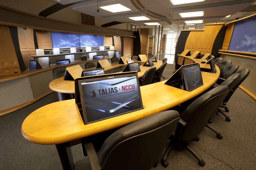 people sitting on chairs watching a game