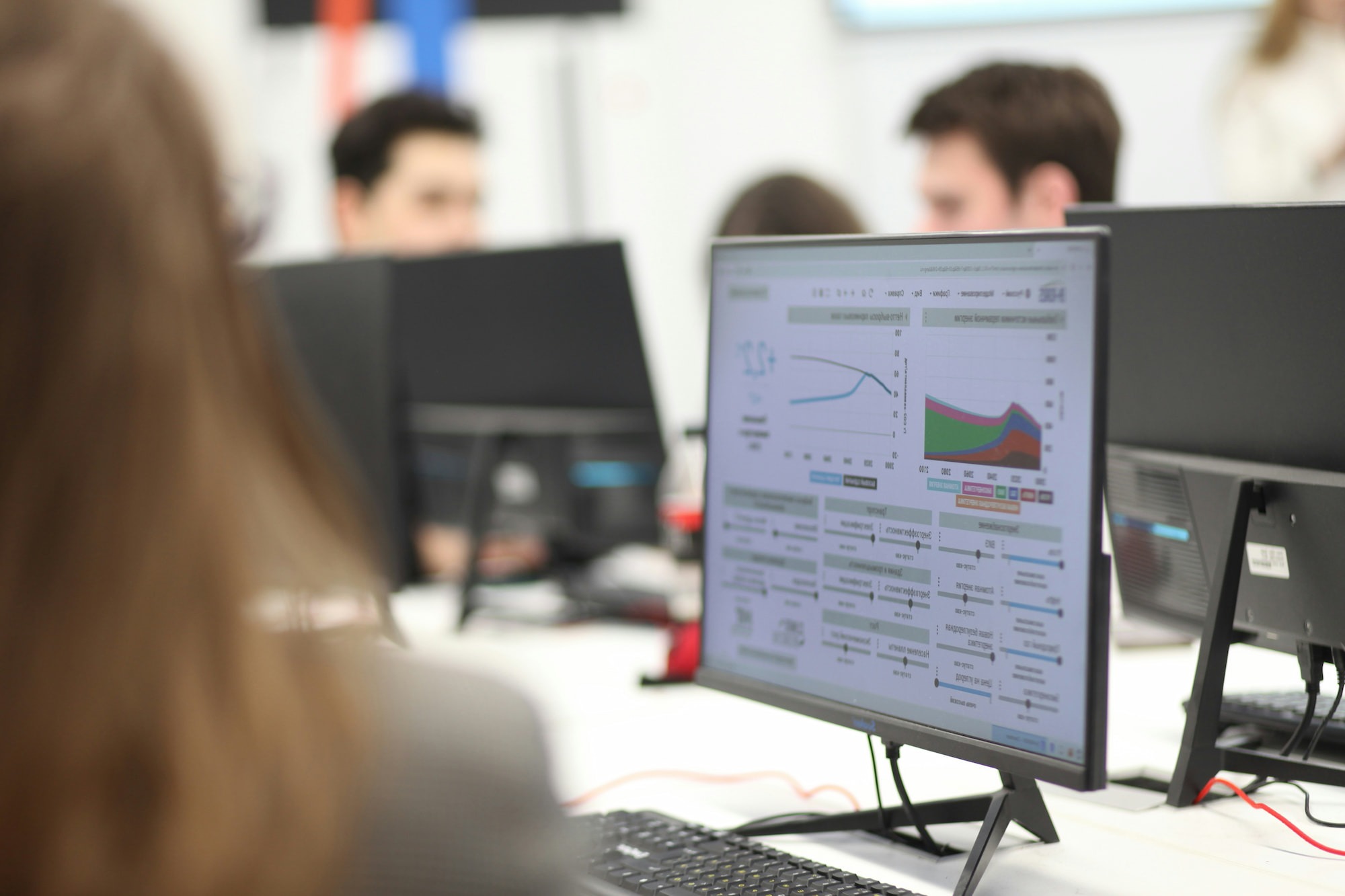 Old chemistry books and scientific glassware on dark fabric.