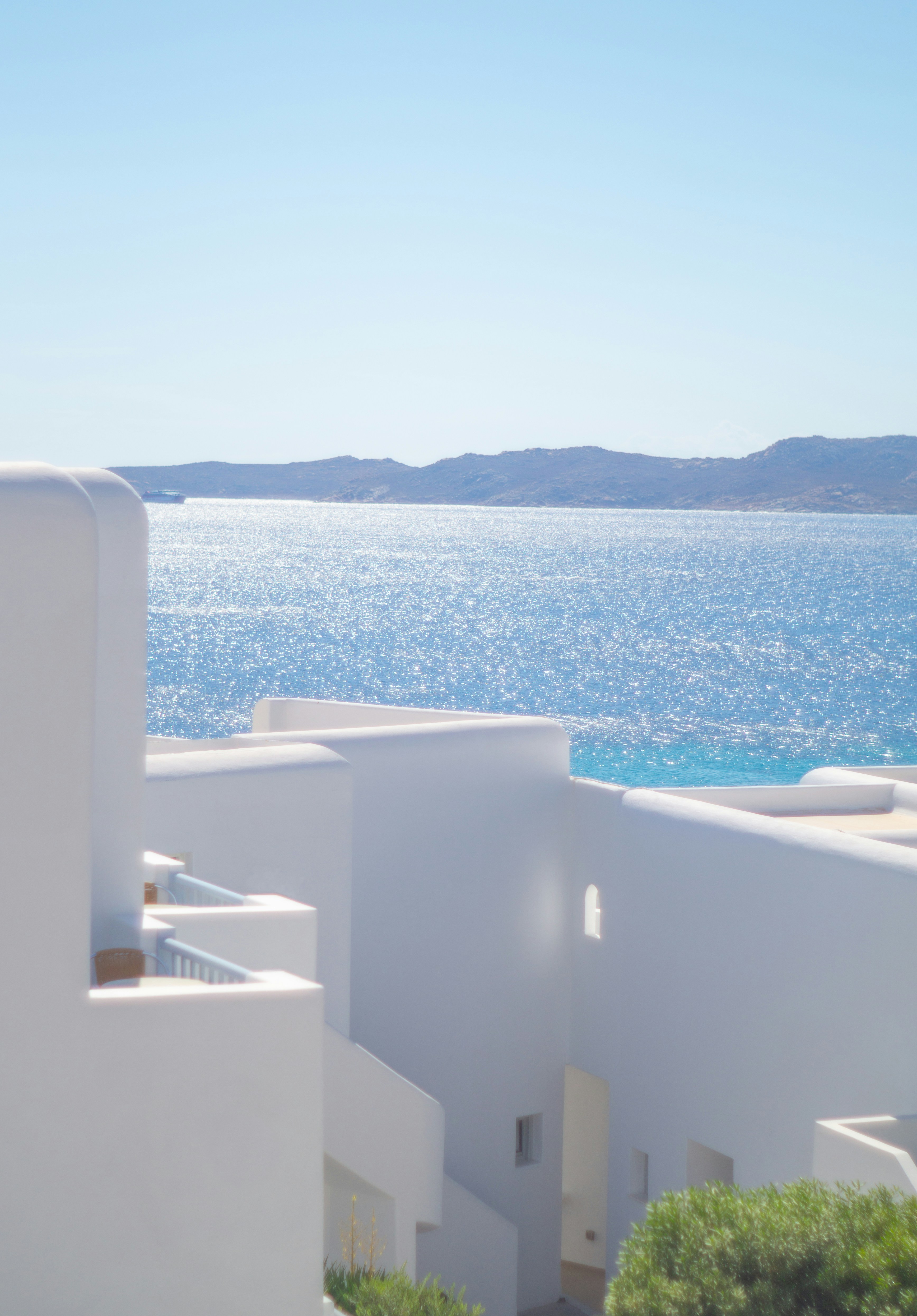 A white building with a view of the ocean