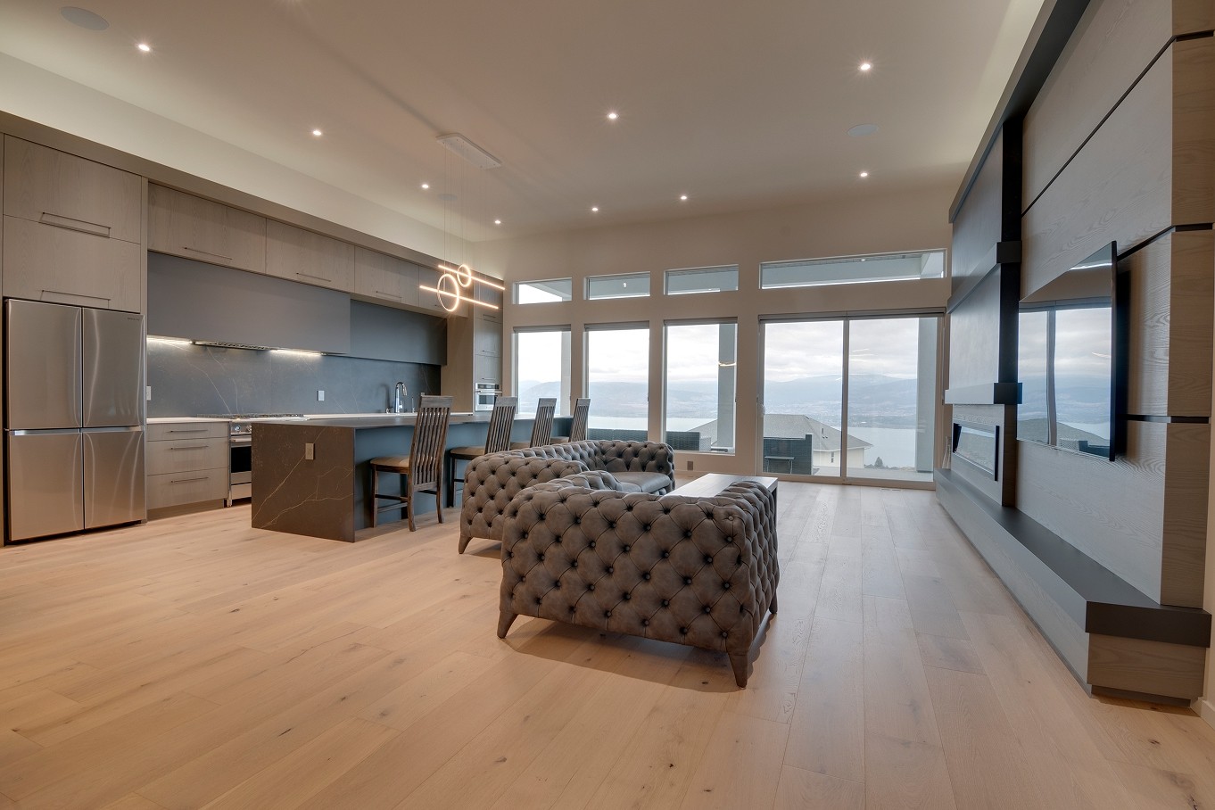Open-concept living area with built-in shelving and natural light