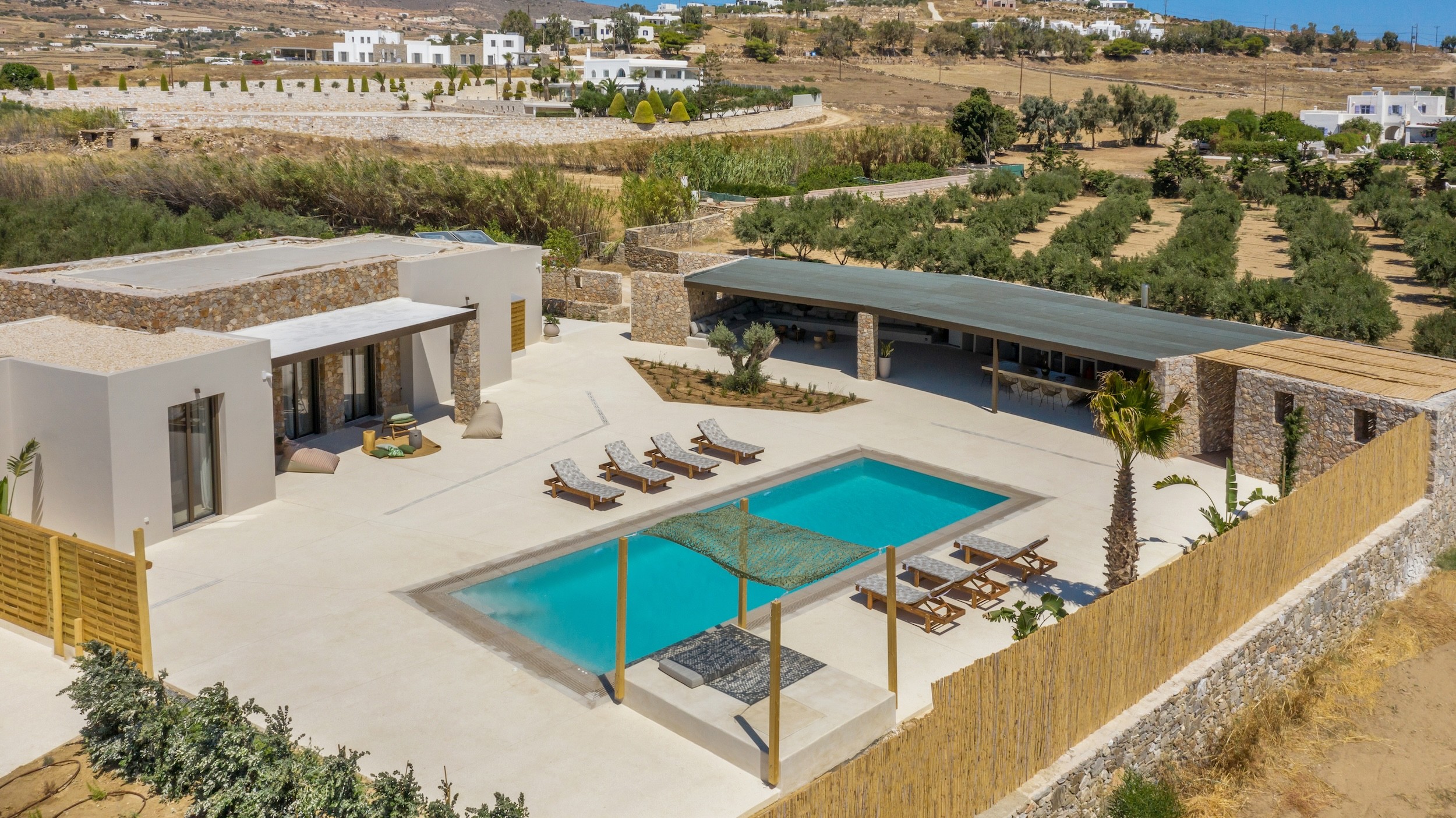 Drone view of modern minimal villa in chrisi akti paros