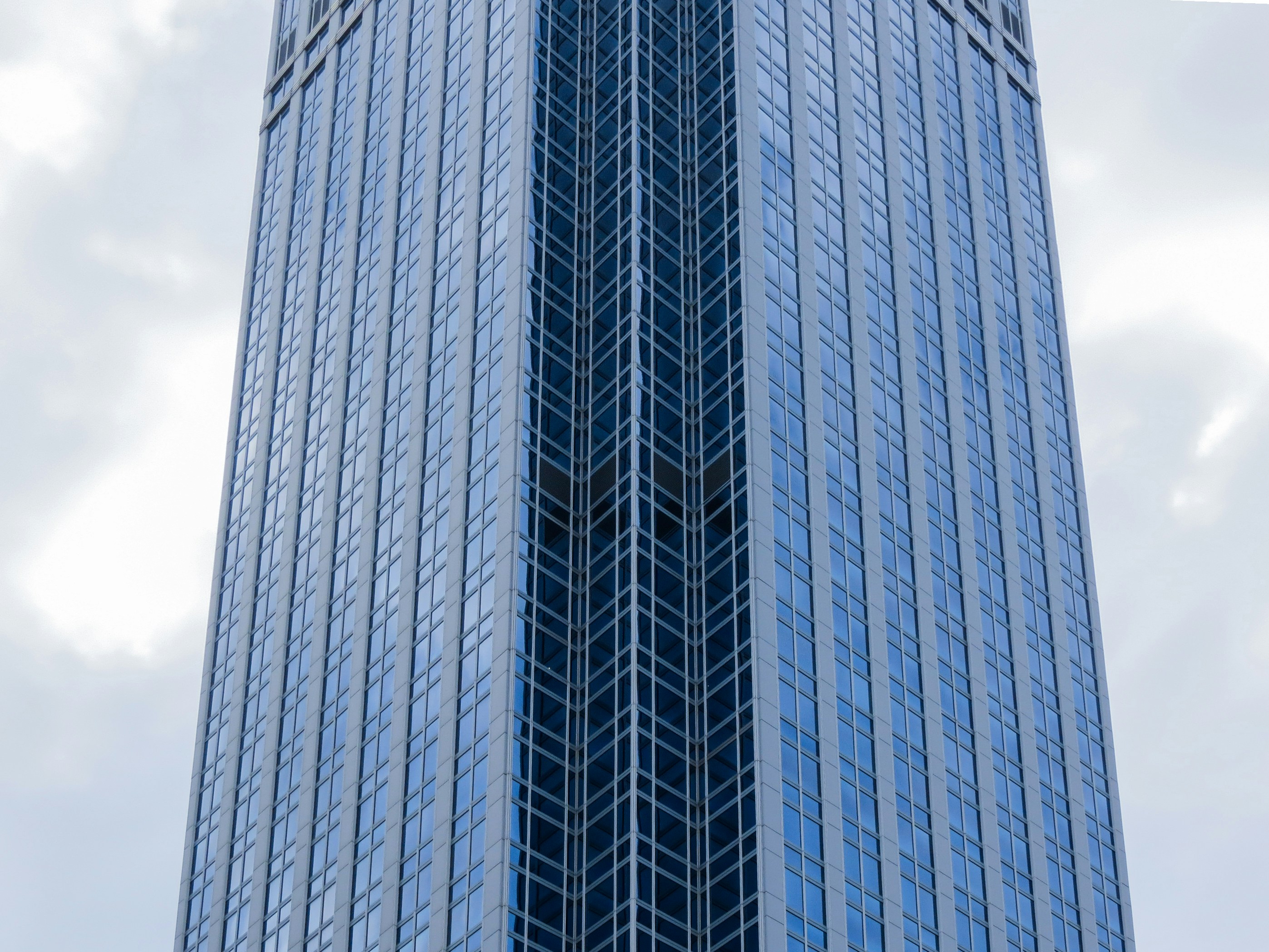 a group of people walking on a sidewalk
