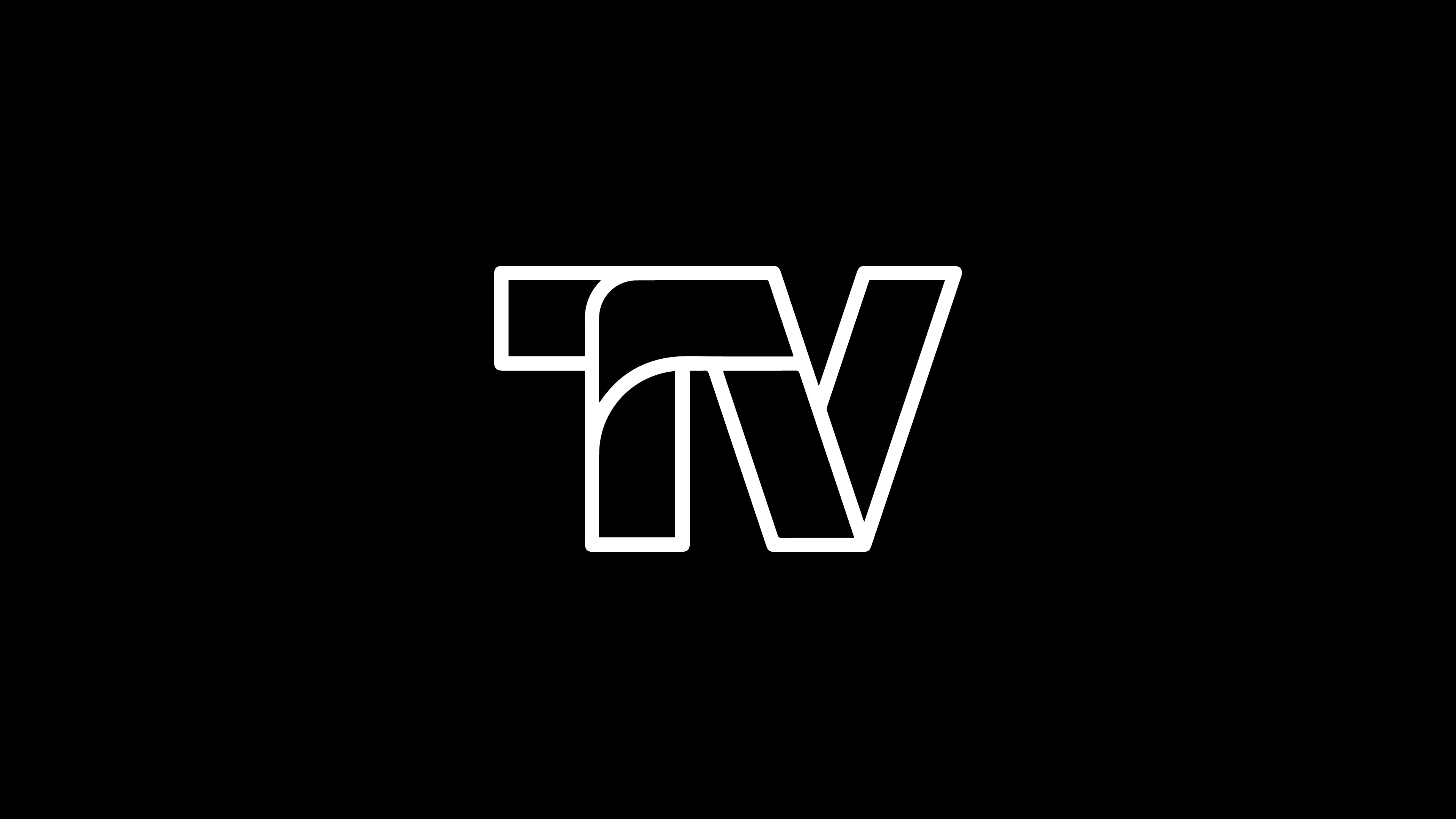 Modern home office setup with a monitor, ergonomic chair, keyboard, and indoor plants near a window with blinds.