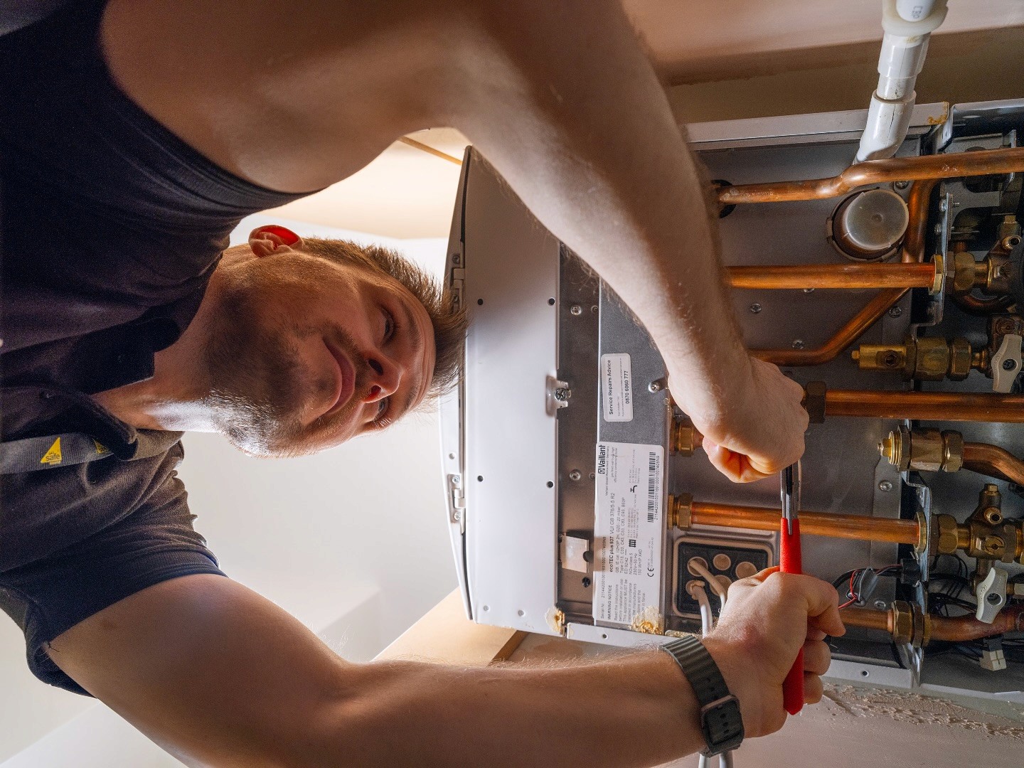 Trusted gas safe engineer carrying out a boiler repair in north london