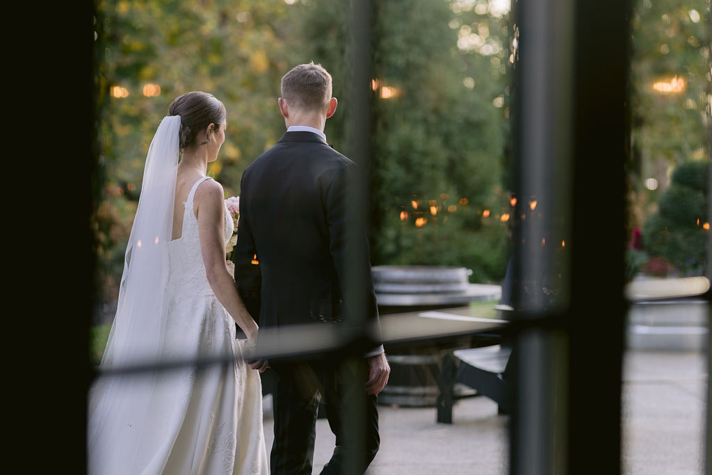 nfinity pool blending into the ocean view, minimalist sun loungers in soft neutral fabric, curved architecture