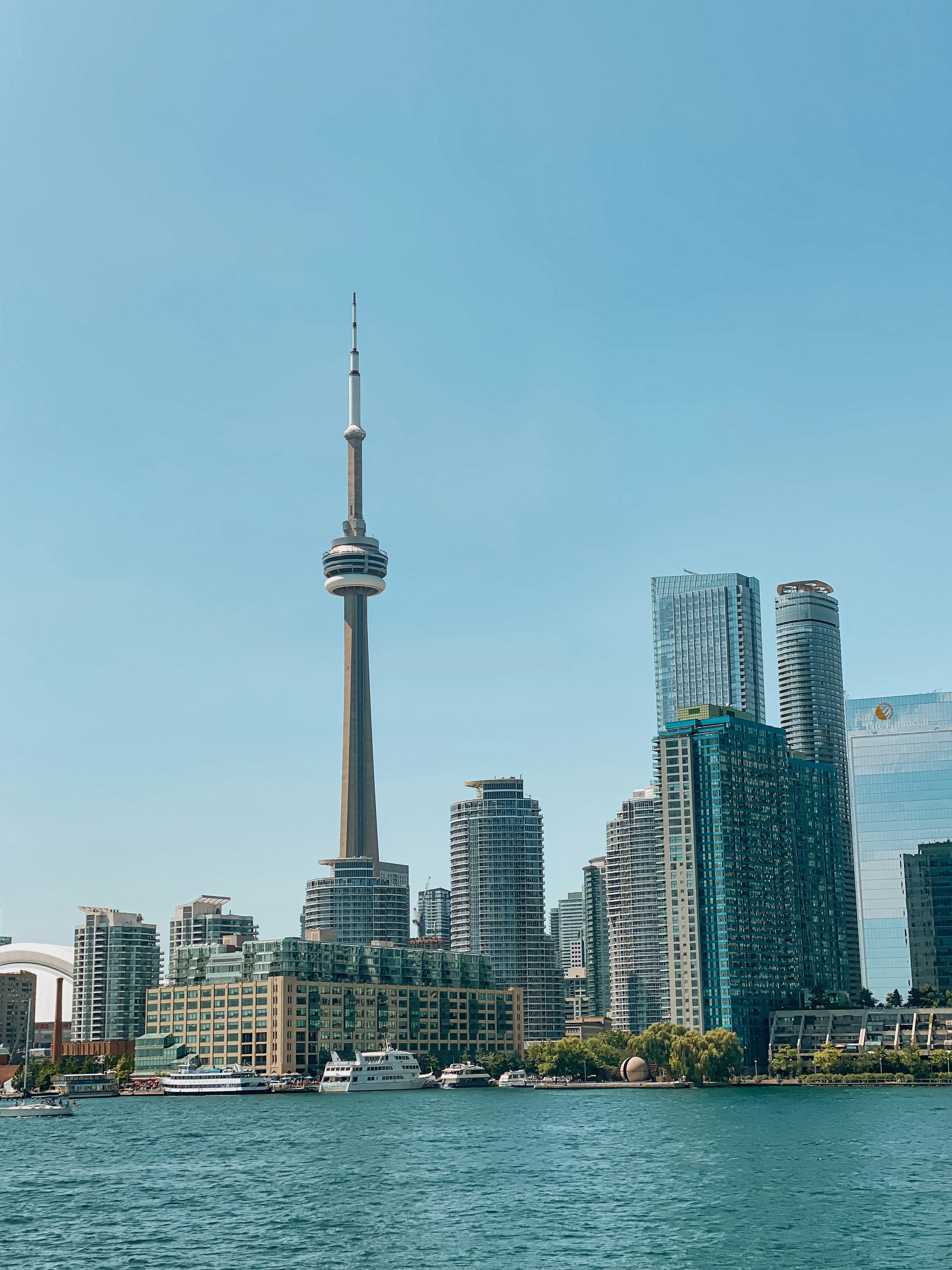 a city skyline with a tall tower