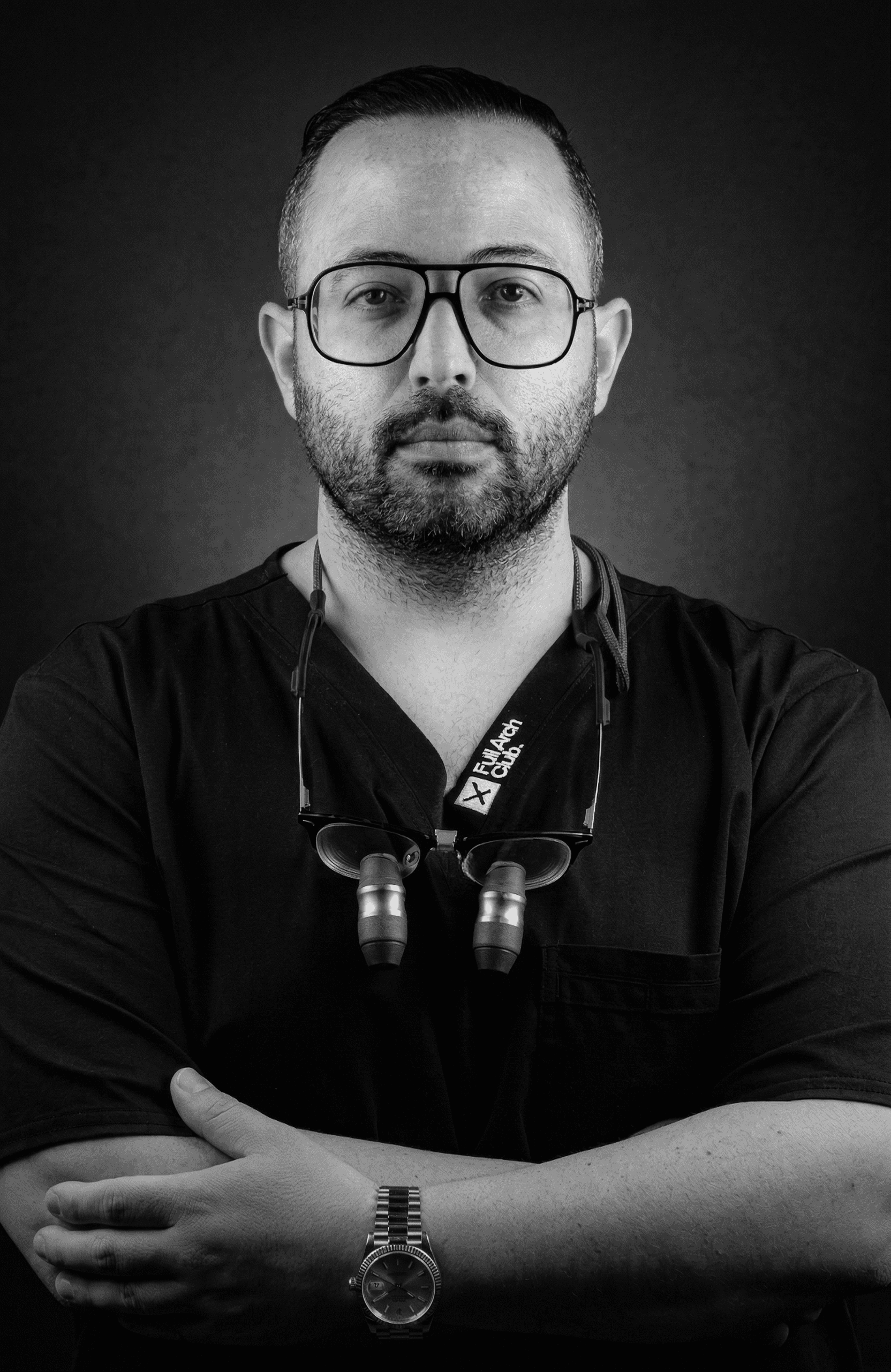 Three models standing in a wheat field, wearing beige suits.