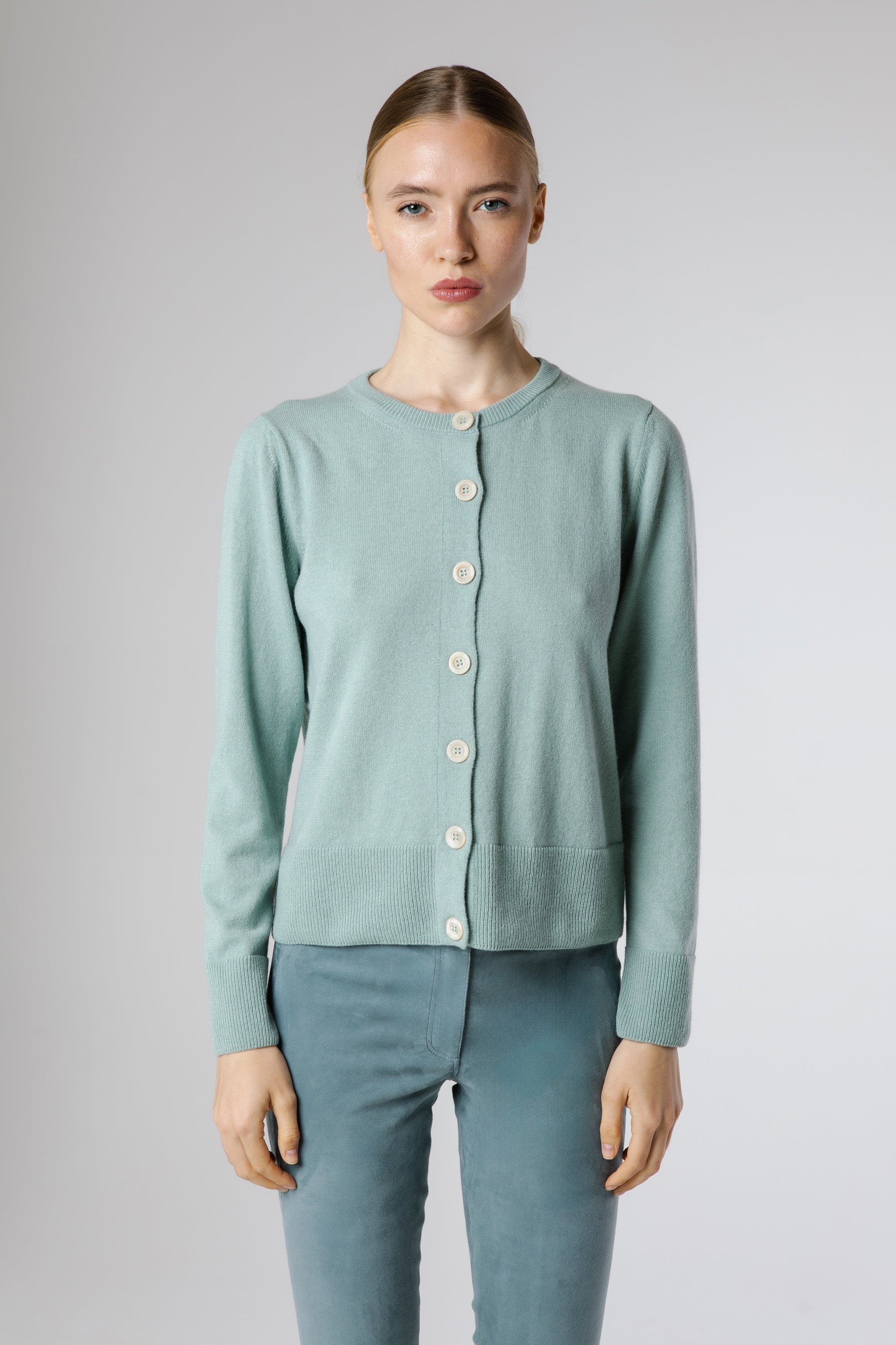 Buy Ginan Cashmere Cardigan Dew online – front view of luxury Italian cashmere women’s cardigan in soft dew blue with round neckline and tonal buttons.