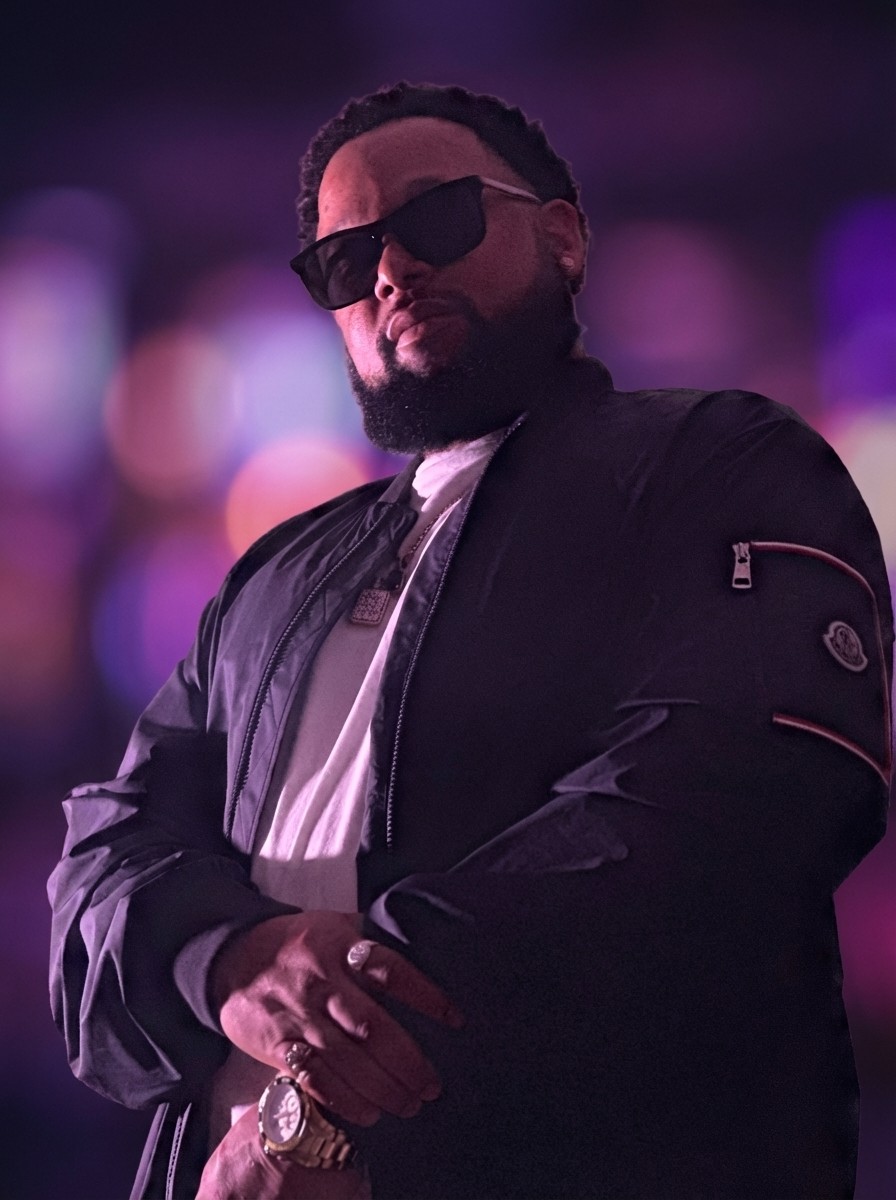 Performer under spotlight on dark stage