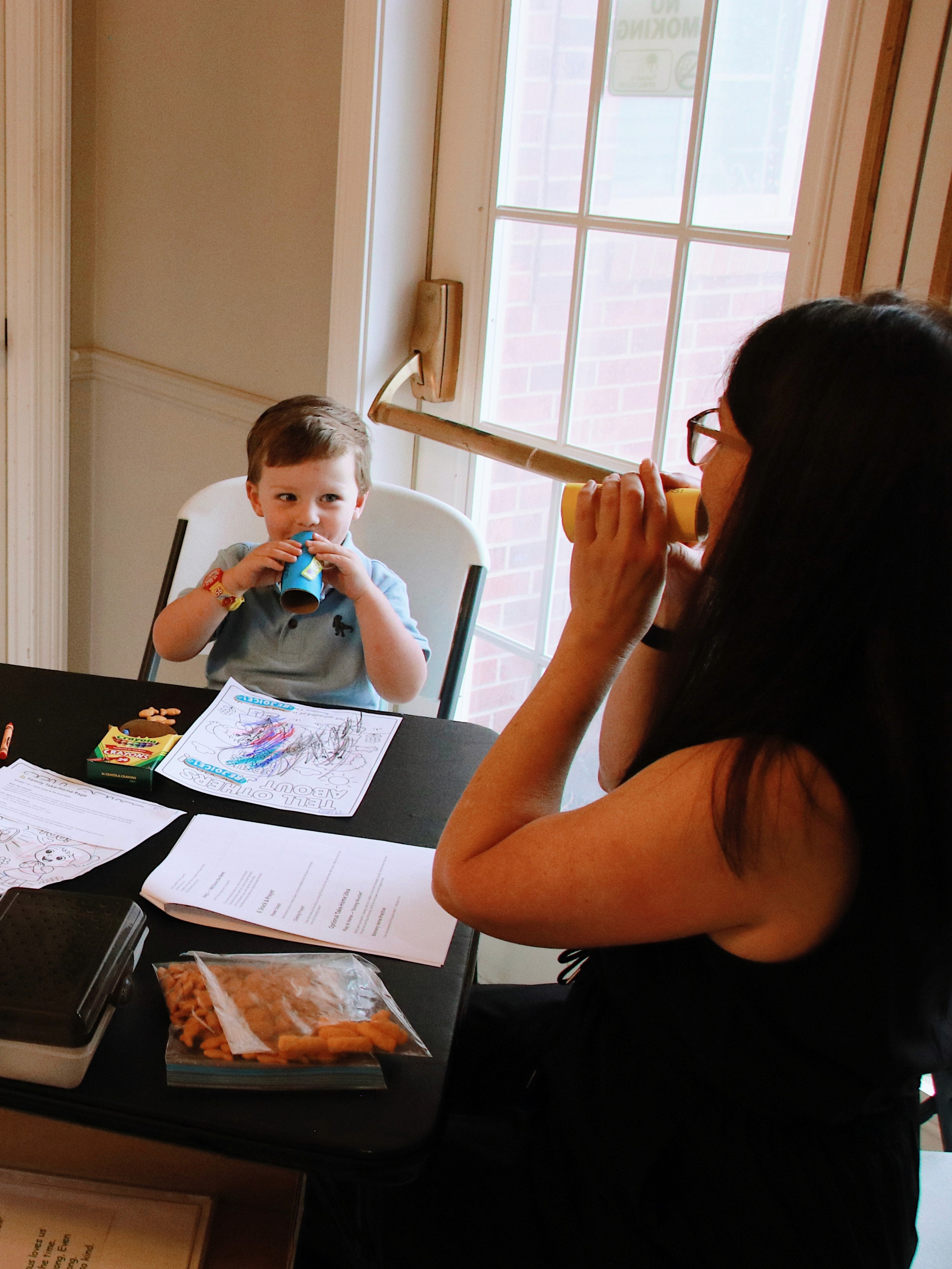 Woman teaching young boy