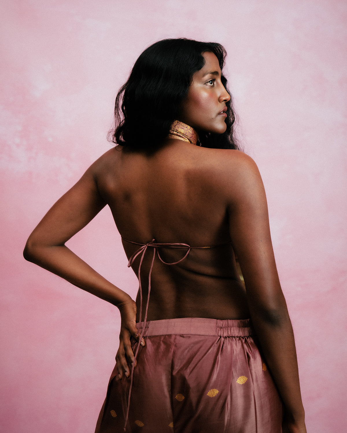 Apsara is our high-neck, backless top crafted from a brocade vintage silk saree, inhouse by skilled artisans. 