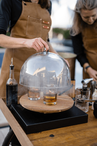 A couple stands closely in an intimate embrace.