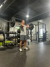 man in black hoodie standing