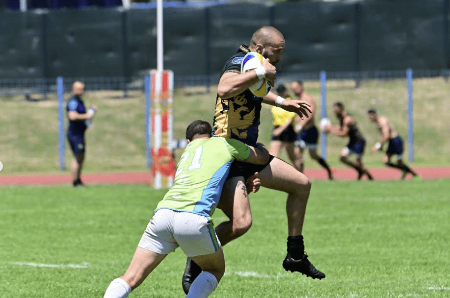 another photo of montegrin rugby players going through defence