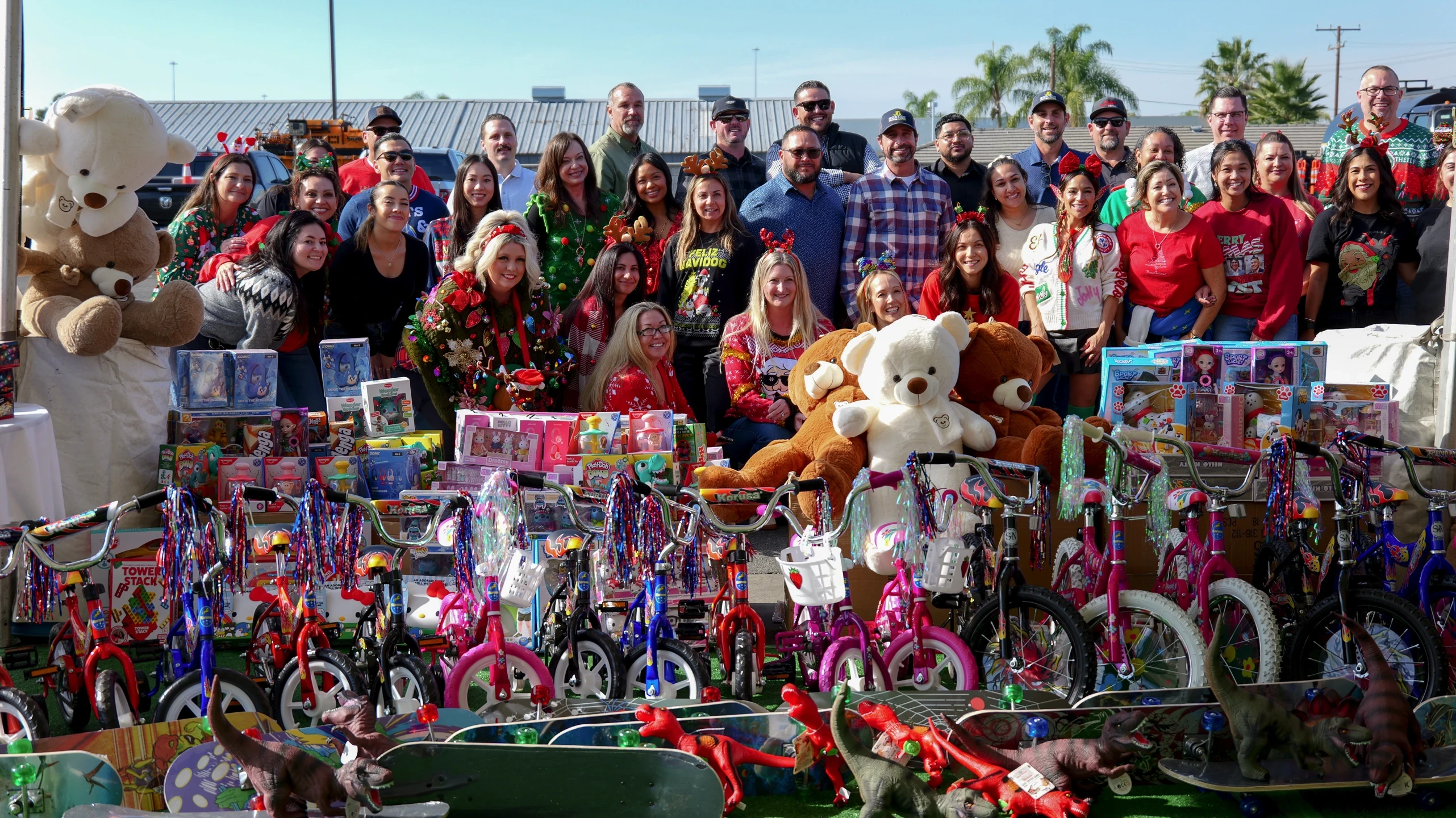 PaveMasters & HIS-OC teams with over 400 donated toys & bikes.