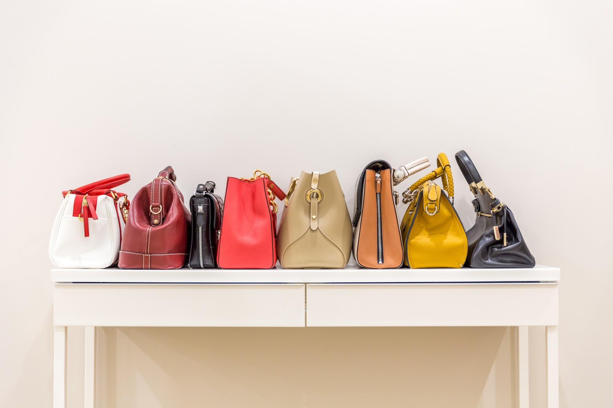 Handbags displayed on a shelf