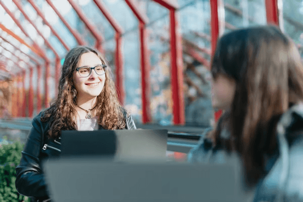 High school student conducting sustainability research with a PhD mentor at a university lab