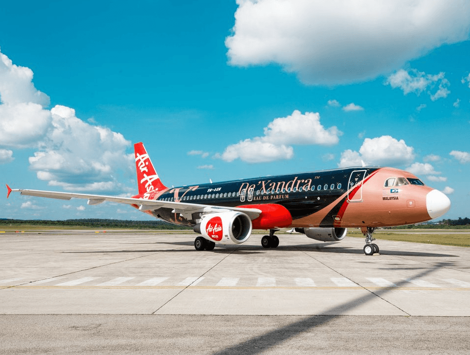 An Air Asia plane with De'Xandra brand sponsorship livery