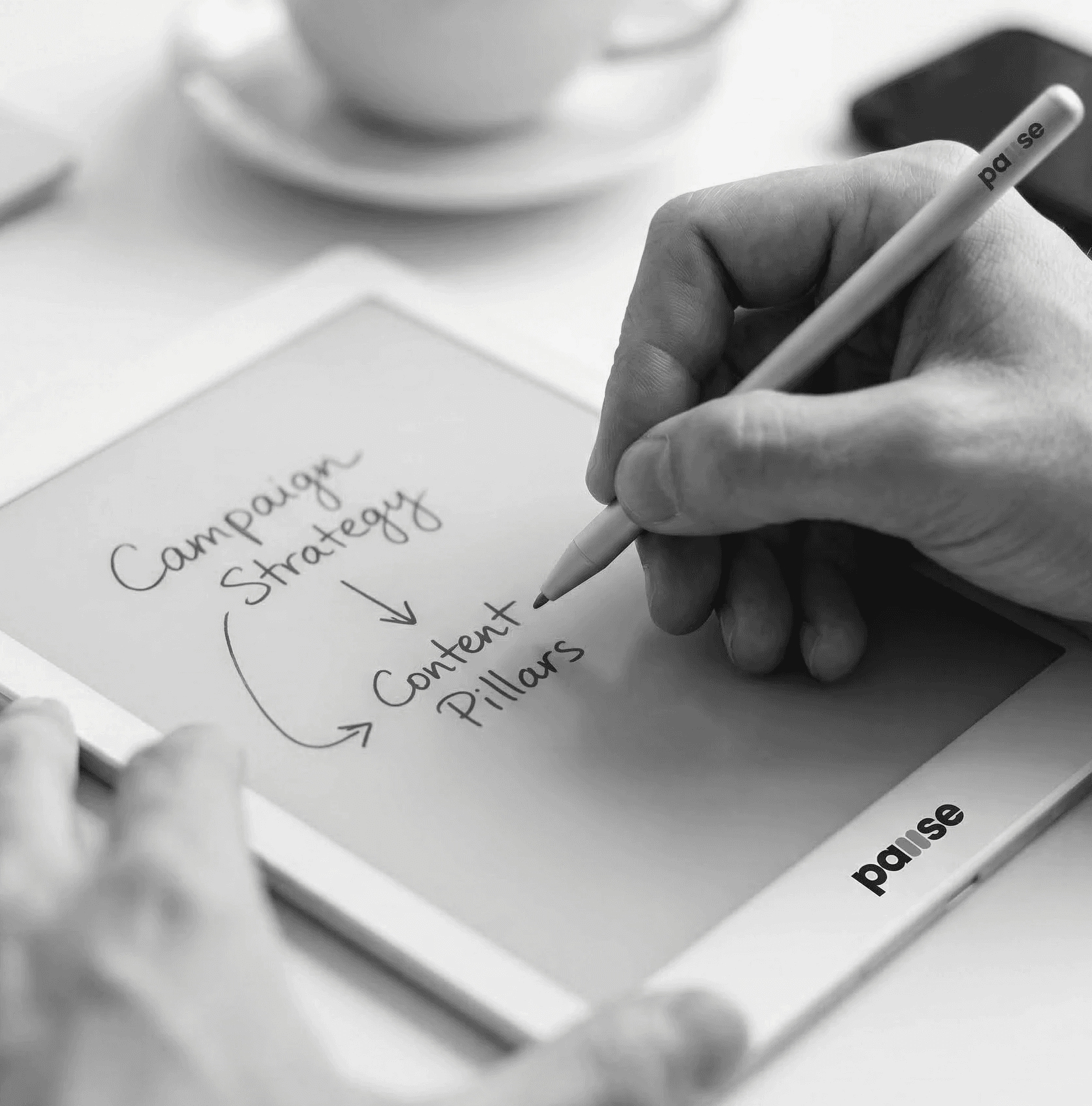 Closeup shot of hands interacting with a tablet