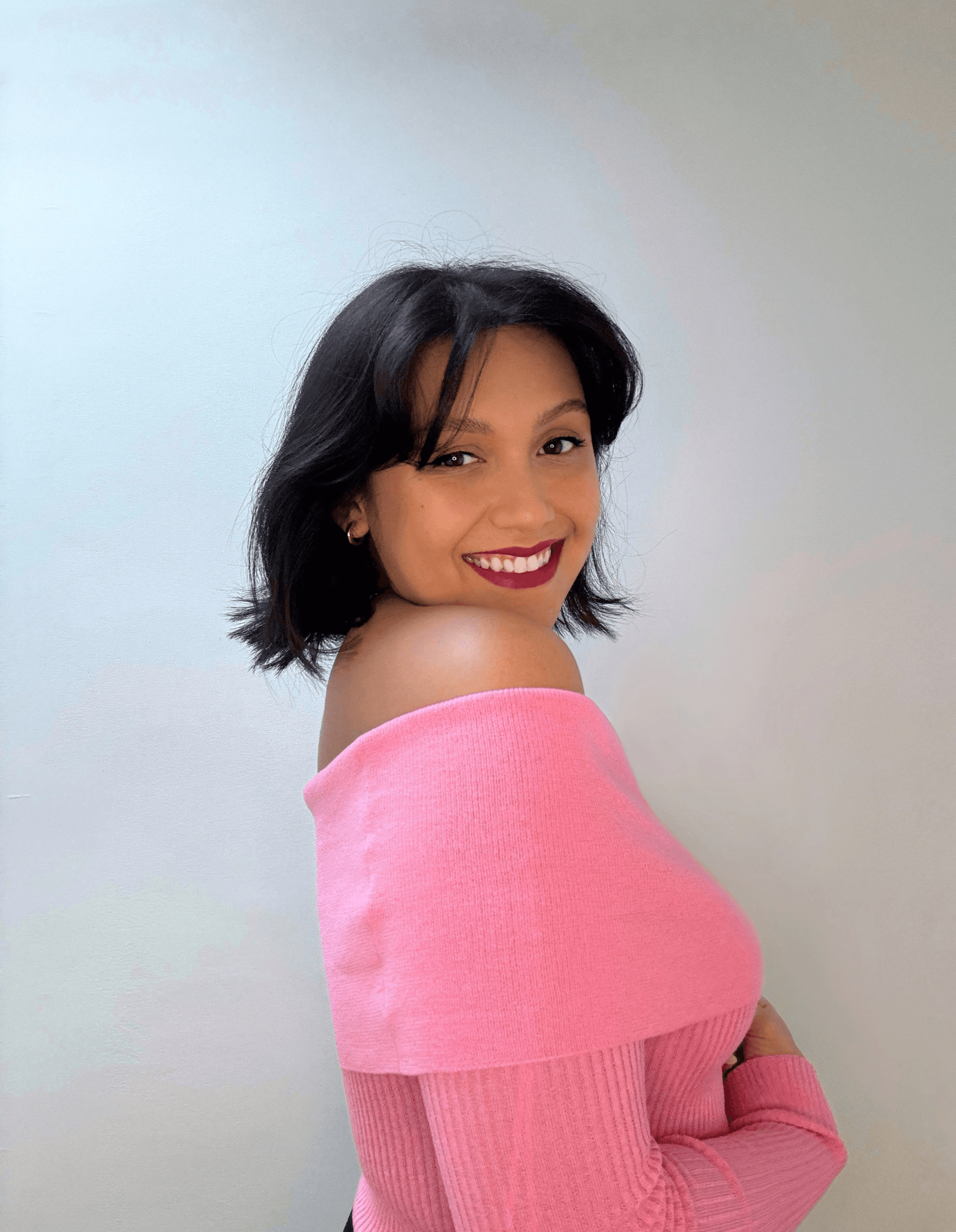 Woman in pink top smiling