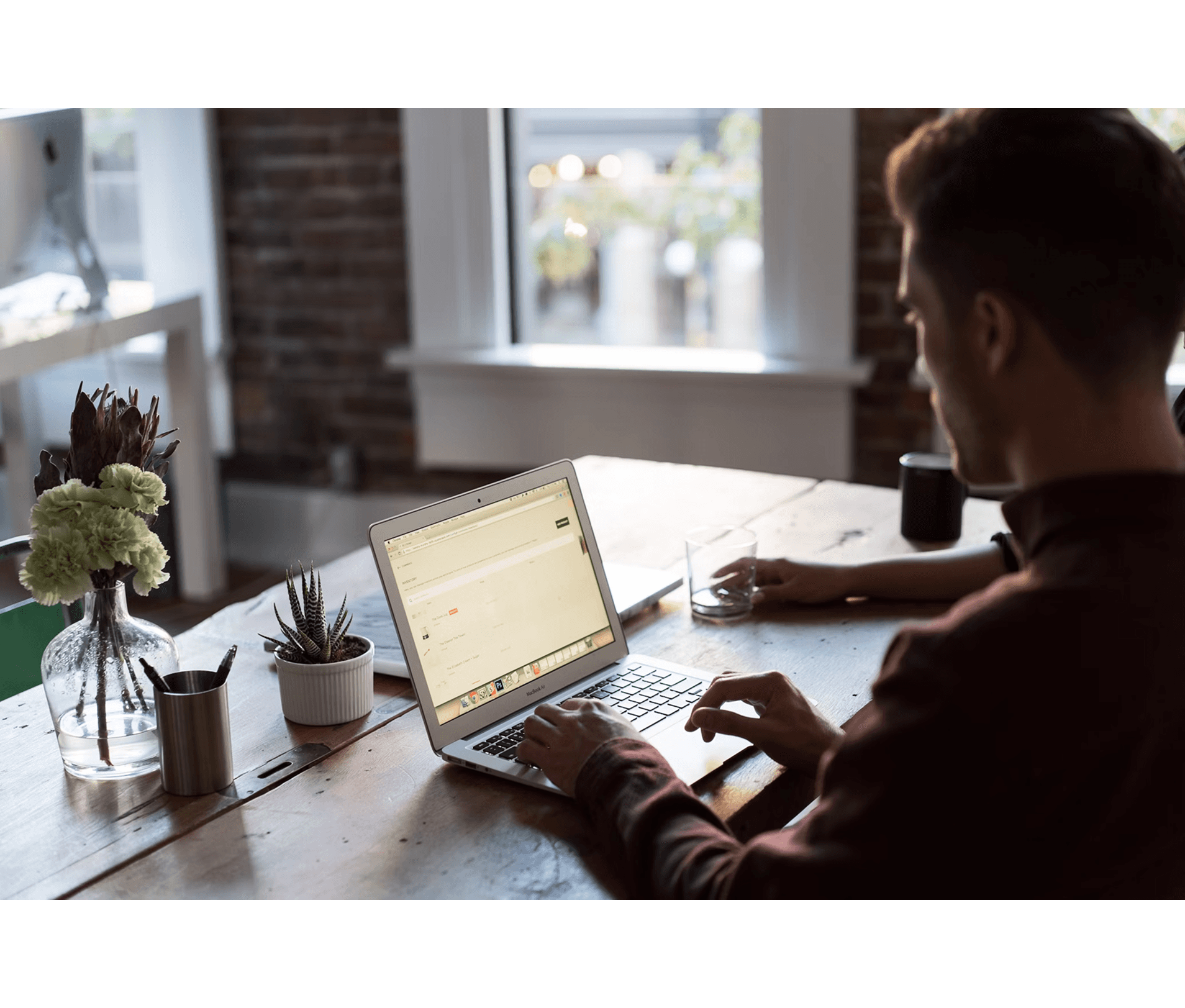 Man typing on computer