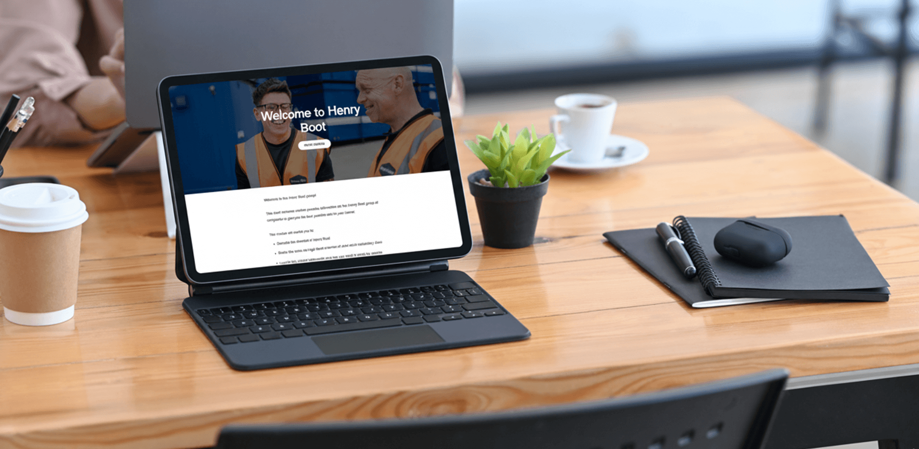 A mockup of the Henry Boot module on a latop on a desk. 