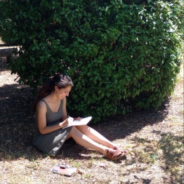 Close up of a woman with eyes closed practicing deep breathing