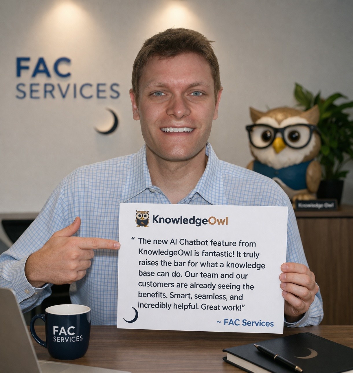 Photo of a smiling man holding a very positive review of KnowledgeOwl's AI Chatbot. A coffee cup, a laptop, and a notebook in front of him, and an owl with glasses behind him.