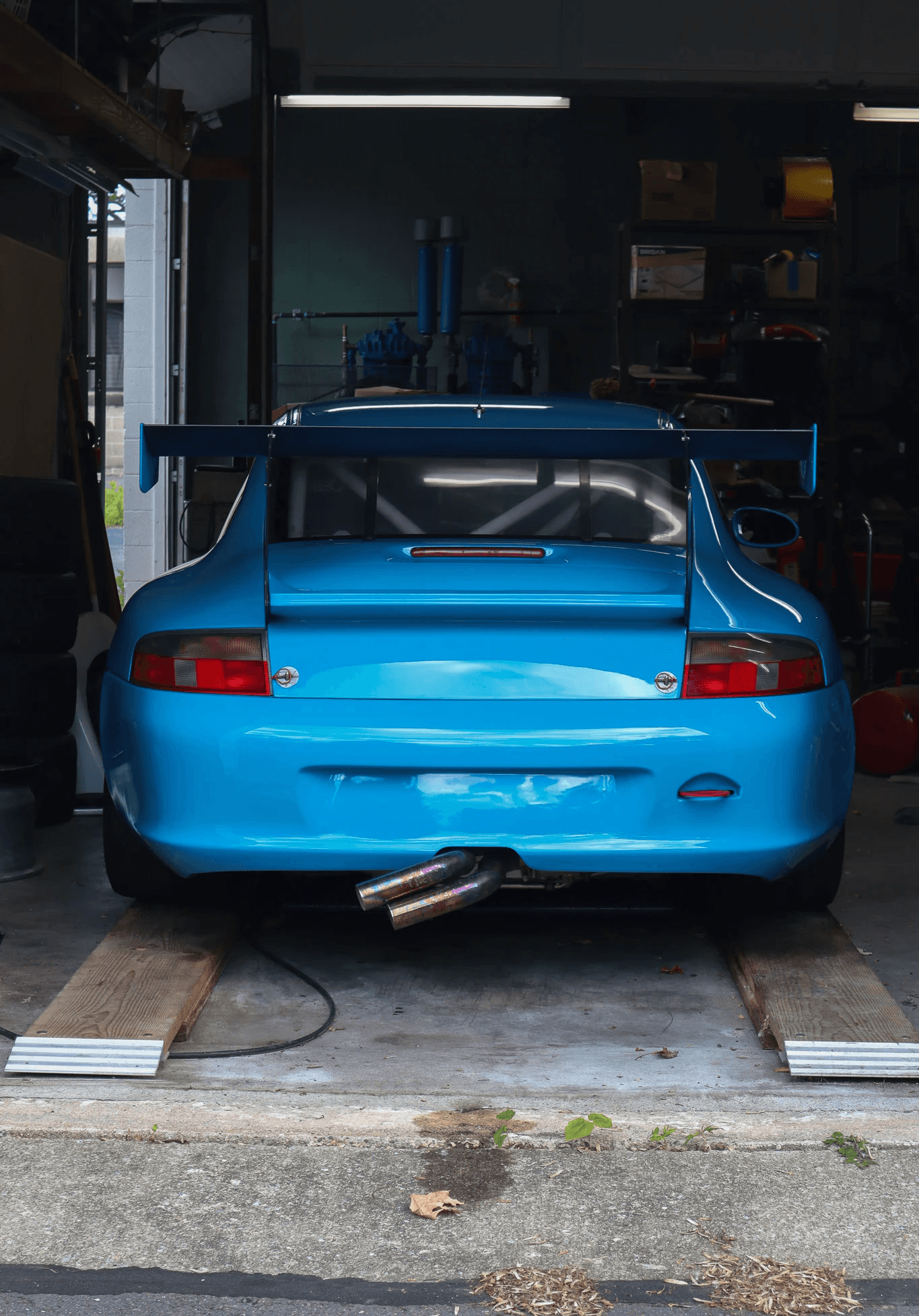 Laptop on a clean desk next to modern decor.