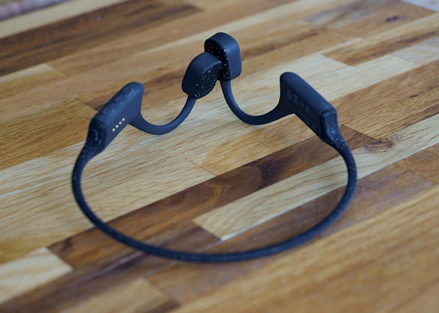 Waterproof swimming earphones sitting on a tabletop