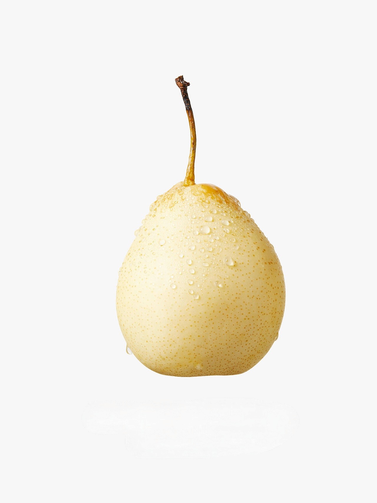 Pear still life photography with water droplets by Lefty Studio